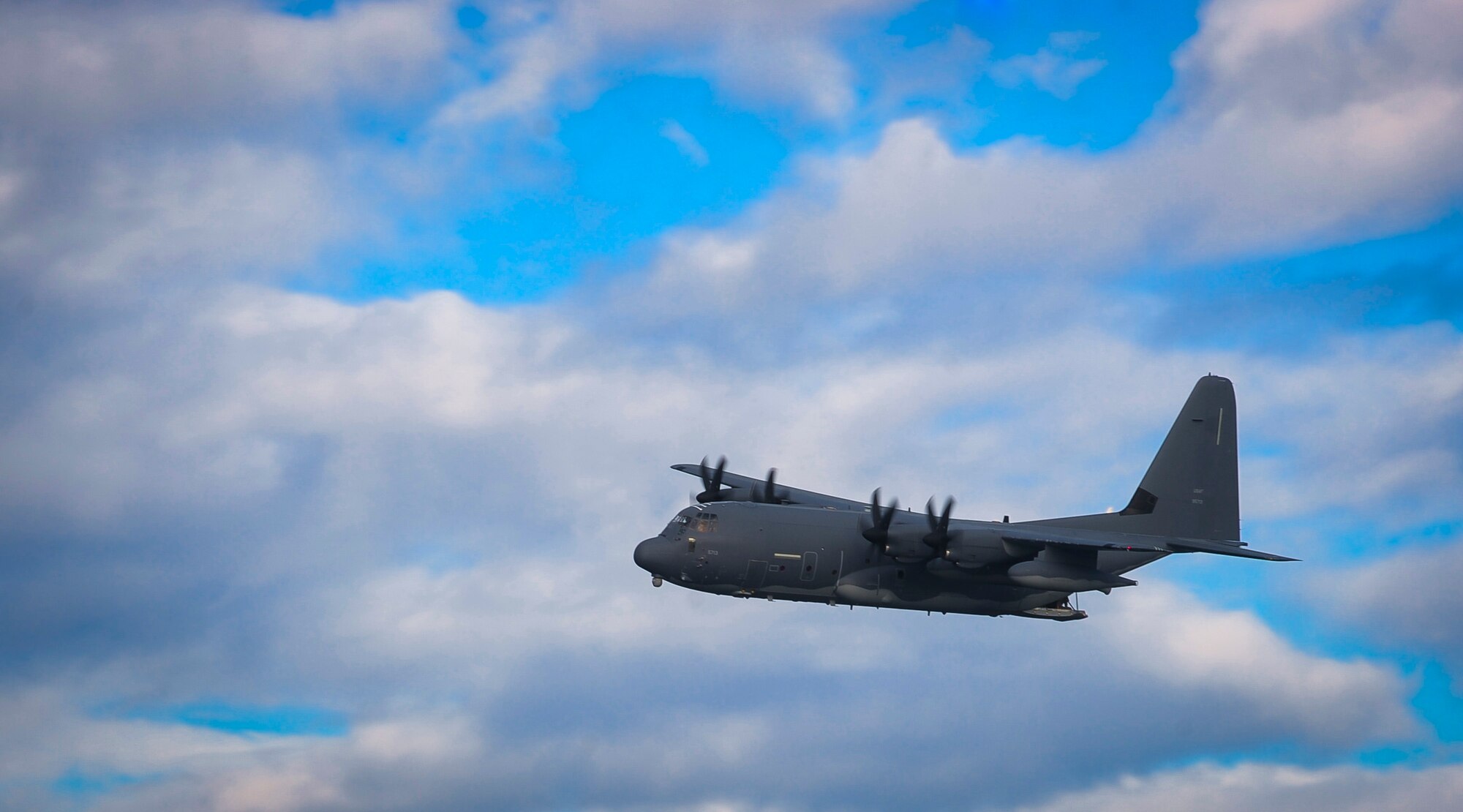 An MC-130H Combat Talon II performs a fly-by after dropping a rigid inflatable boat into the Gulf of Mexico during Maritime Craft Aerial Delivery Systems training, Nov. 12, 2015. MCADS enable special operation forces members to rapidly deploy anywhere around the world in a maritime environment. (U.S. Air Force photo by Senior Airman Meagan Schutter)