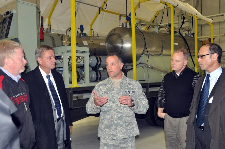 Senior Master Sgt. Phil Aliberti (center), chief of the 910th Aerial Spray Maintenance flight, shows off a Modular Aerial Spray System to a group of Distinguished Visitors (DVs) during a tour stop here, Nov. 13, 2015. The group, including Ohio District 63 State Representative Sean O’Brien (left); Ohio District 99 State Representative John Patterson (left); Youngstown State University Veterans Resource Center Director Rick Williams (second from right) and Youngstown-Warren Regional Chamber Vice President for Government and Media Affairs Guy Coviello (far right), was participating in a tour of various sites across the Mahoning Valley organized by YSU President James Tressel. YARS was included in the tour because of its role as the only military base in Northeast Ohio as well as being home to the 910th Airlift Wing and the Department of Defense’s only large-area, fixed wing aerial spray capability. (U.S. Air Force photo/Master Sgt. Bob Barko Jr.)
