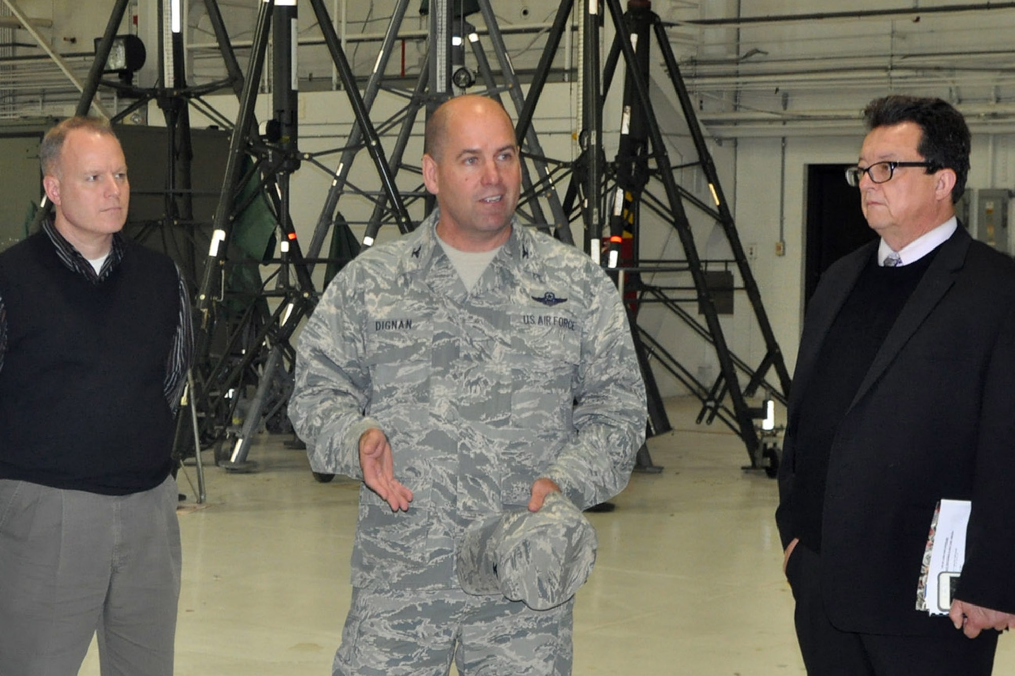 Col. James Dignan (center), commander of the 910th Airlift Wing, addresses a group of Distinguished Visitors (DVs) during a tour stop here, Nov. 13, 2015. The group, including Youngstown State University Veterans Resource Center Director Rick Williams (right) and former Ohio District 66 State Representative Michael Verich (right), was participating in a tour of various sites across the Mahoning Valley organized by YSU President James Tressel. YARS was included in the tour because of its role as the only military base in Northeast Ohio as well as being home to the 910th Airlift Wing and the Department of Defense’s only large-area, fixed wing aerial spray capability. (U.S. Air Force photo/Master Sgt. Bob Barko Jr.)