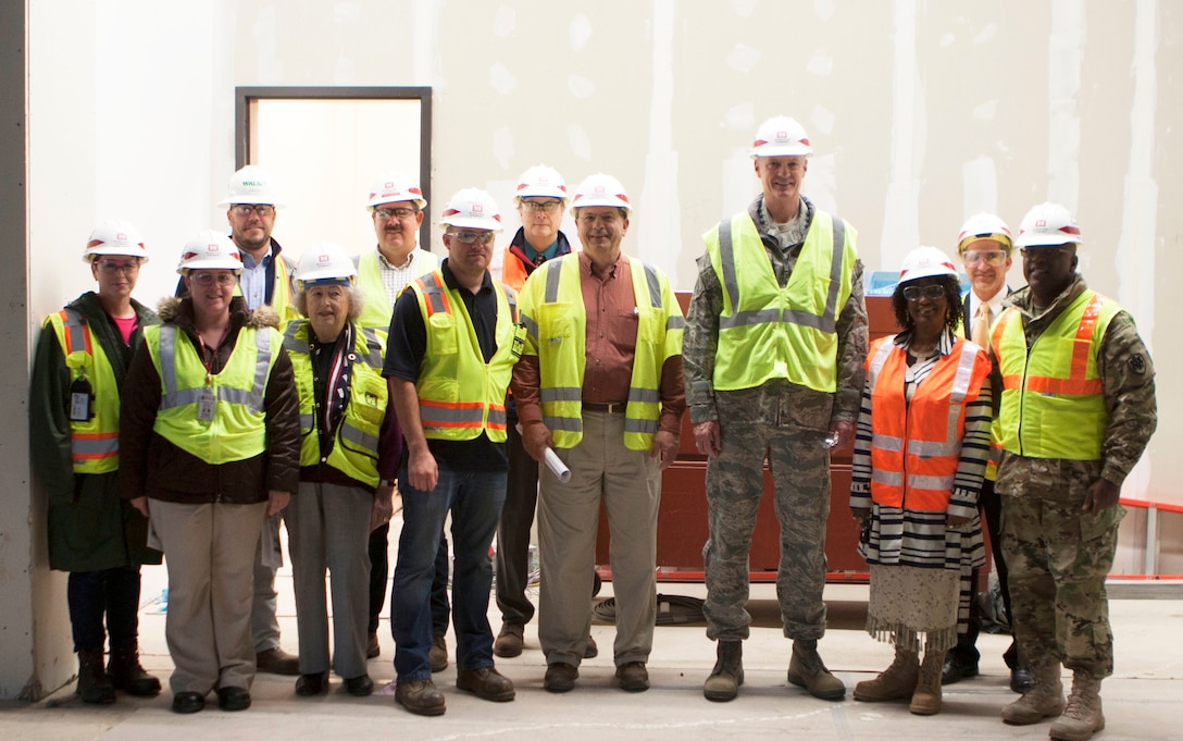 DLA Director Air Force Lt. Gen. Andrew E. Busch (4th from right), DLA Distribution commander, Army Brig. Gen. Richard B. Dix (right) and Robert Montefour, DS Installation Support for Susquehanna (2nd from right) pose with members of the Army Corps Engineers in the lobby of the new DLA Distribution Headquarters building in New Cumberland, Pa.