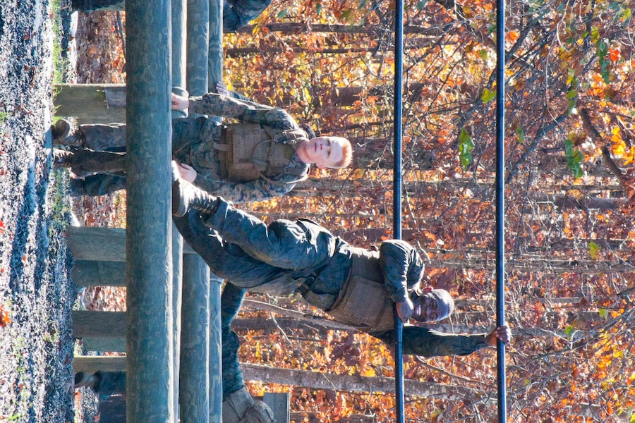 Cpl. Blake Fauble, left, 3rd Battalion, 3rd Marines in Kaneohe, Hawaii, and Sgt. Michael Redd, Marine Corps Recruit Depot in San Diego, complete an obstacle course Nov. 4 during the final event to complete the Marine Corps Martial Arts Program instructor trainer course at The Martial Arts Center of Excellence.