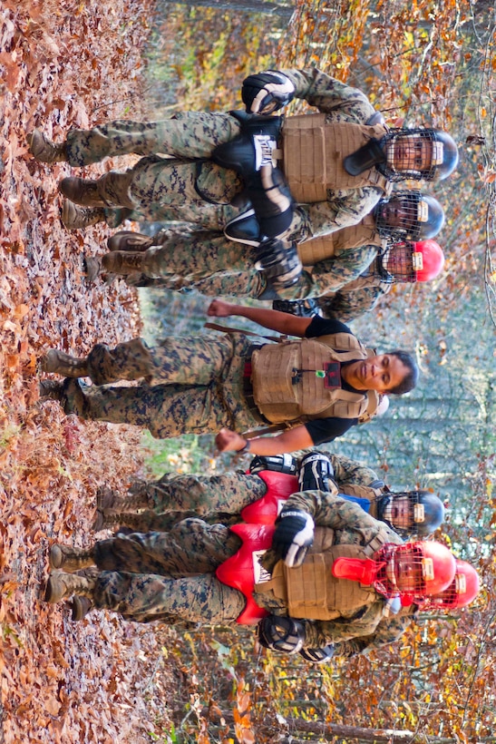 Staff Sgt. Lawanda Ruiz, instructor trainer at the Martial Arts Center of Excellence, trains a squad of Marines in bayonet fighting Nov. 4 during the final event to complete Marine Corps Martial Arts Program instructor trainer course at The Martial Arts Center of Excellence. Ruiz has worked at the MACE for one year.