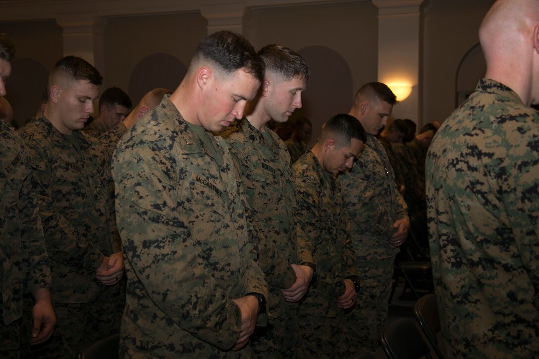 Marines from Marine Barracks Washington, D.C., bow their heads in prayer during the Bravo Company change of command at Marine Barracks Washington, D.C., Nov. 18,2015. (U.S. Marine Corps photo by Cpl. Skye Davis/Released)