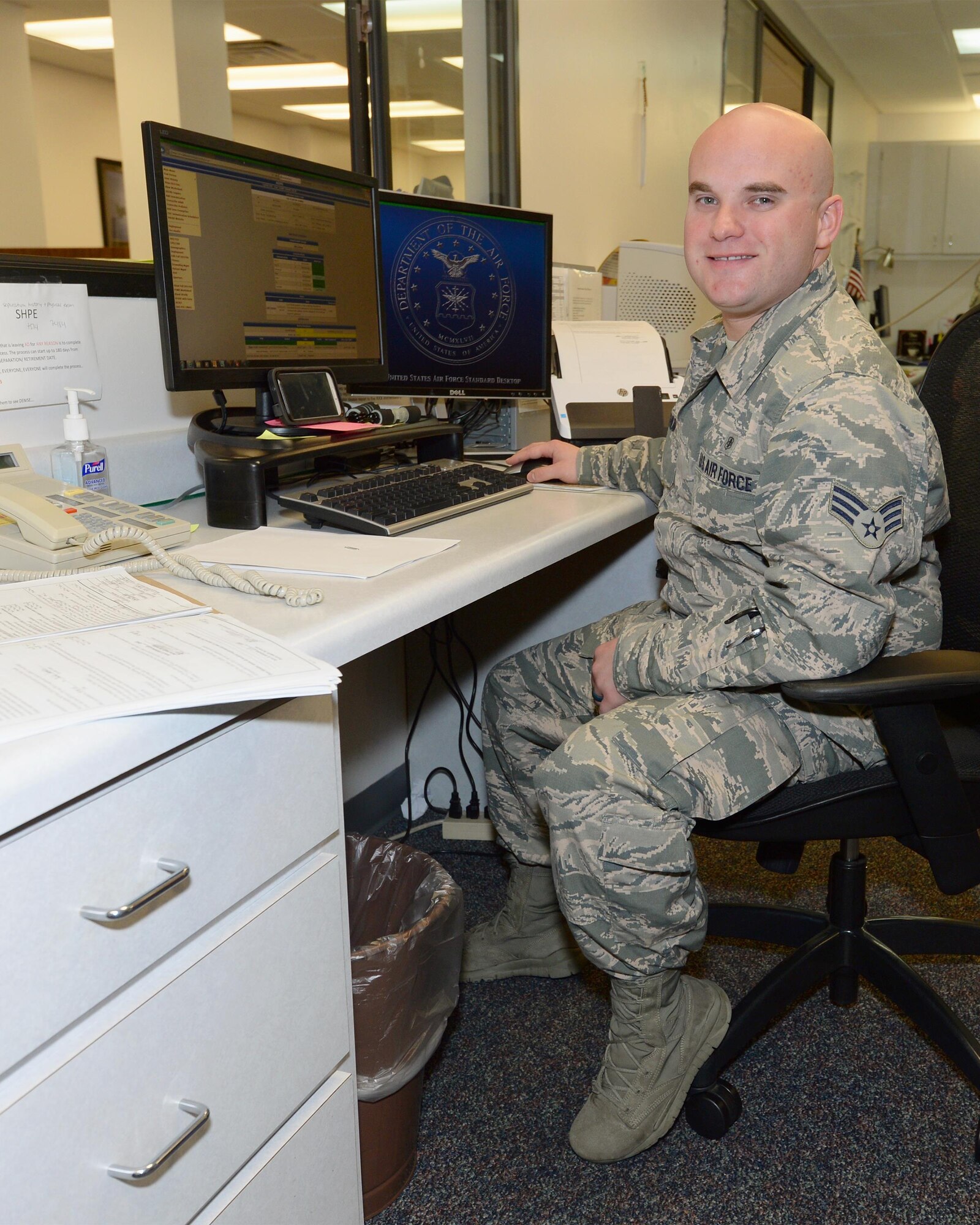 Senior Airman Tyler Washum, 325th Aerospace Medicine Squadron public health technician mans the front desk for his office, Oct. 5th. Members of the 325th AMDS have the mission of supporting the 325th Fighter Wing by providing medical, dental, and preventive care enabling all wing and associate units to maximize readiness and combat capability. (U.S. Air Force photo by Airman 1st Class Cody R. Miller)