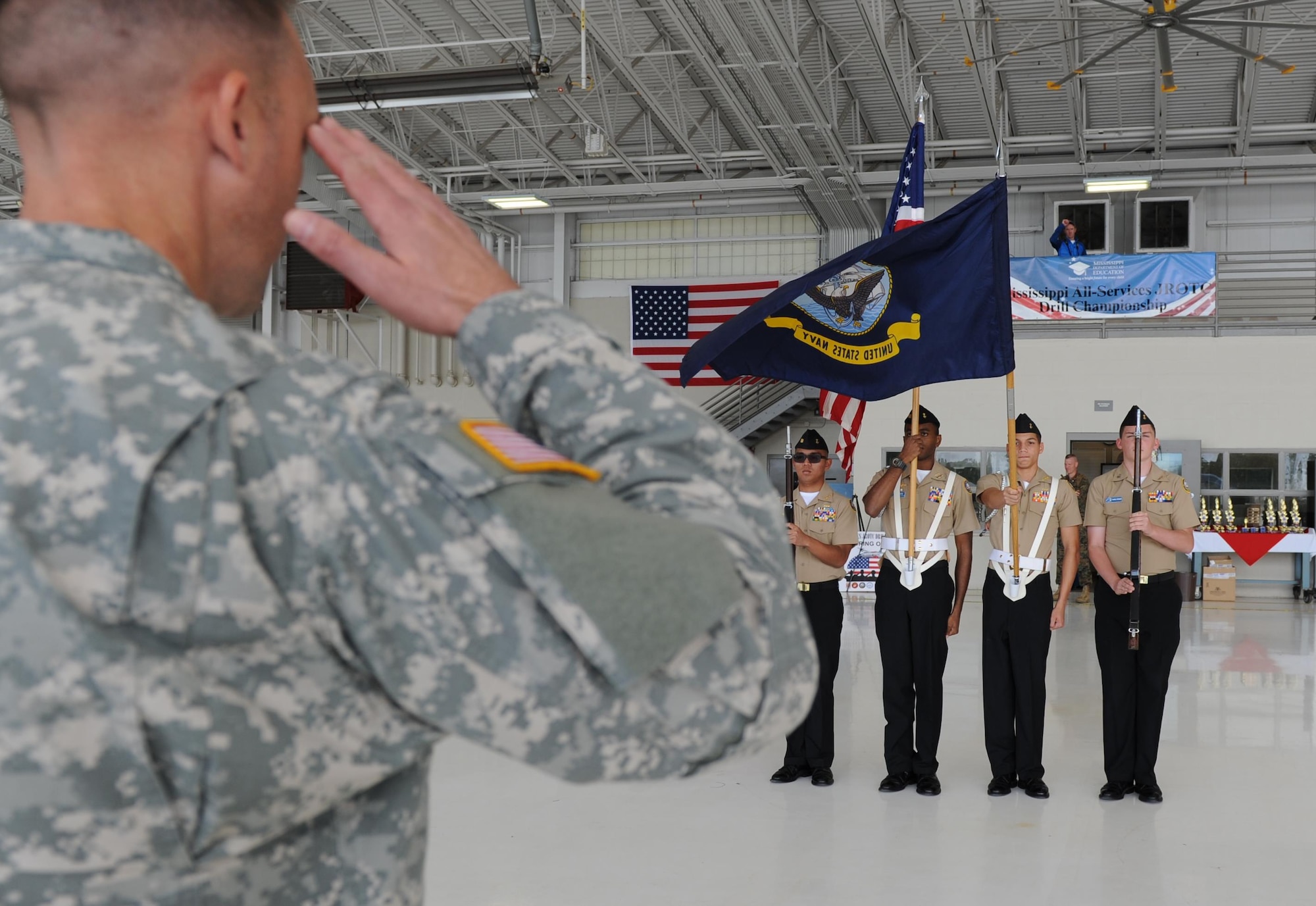Navy Junior ROTC cadets from Pascagoula High School, Pascagoula, Miss., request permission to participate in the honor guard exhibition during the second annual Mississippi All-Services Junior ROTC Drill Competition Nov. 14, 2015, at Keesler Air Force Base, Miss. Seventeen Junior ROTC teams from all military branches were represented at the event. Approximately 800 Junior ROTC cadets and spectators were in attendance where cadets battled for the best all-services Junior ROTC team in Mississippi. (U.S. Air Force photo by Kemberly Groue)