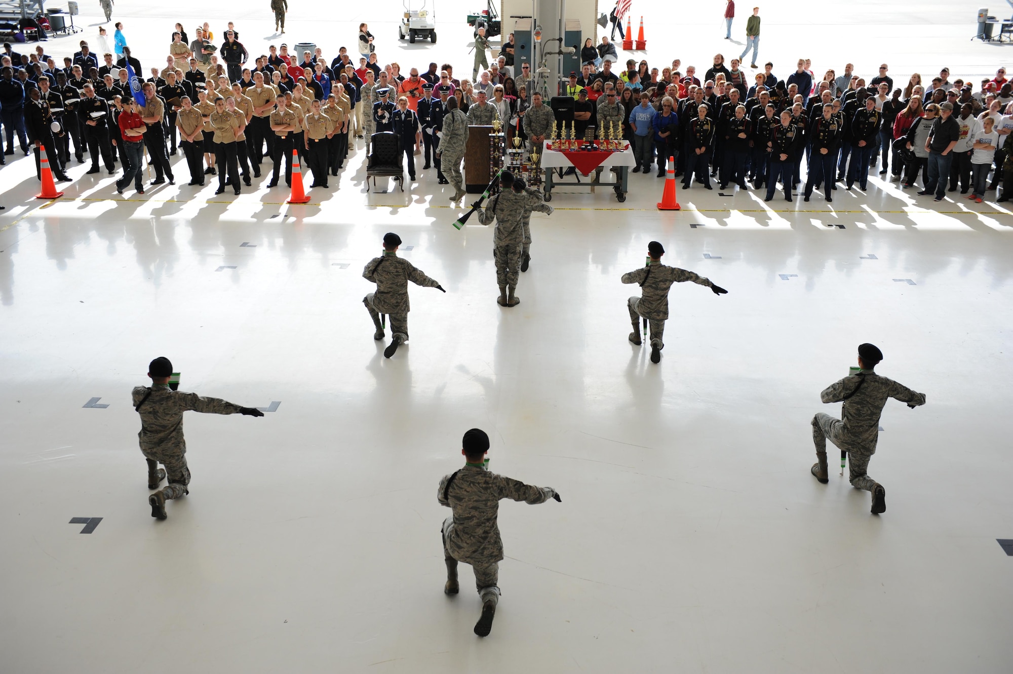 Members of the 334th Training Squadron freestyle drill team performs for Junior ROTC cadets during the second annual Mississippi All-Services Junior ROTC Drill Competition Nov. 14, 2015, at Keesler Air Force Base, Miss. Seventeen Junior ROTC teams from all military branches were represented at the event. Approximately 800 Junior ROTC cadets and spectators were in attendance where cadets battled for the best all-services Junior ROTC team for Mississippi. Recruiting booths and static displays, including military vehicles, equipment and an aircraft were available to the cadets throughout the competition. (U.S. Air Force photo by Kemberly Groue)