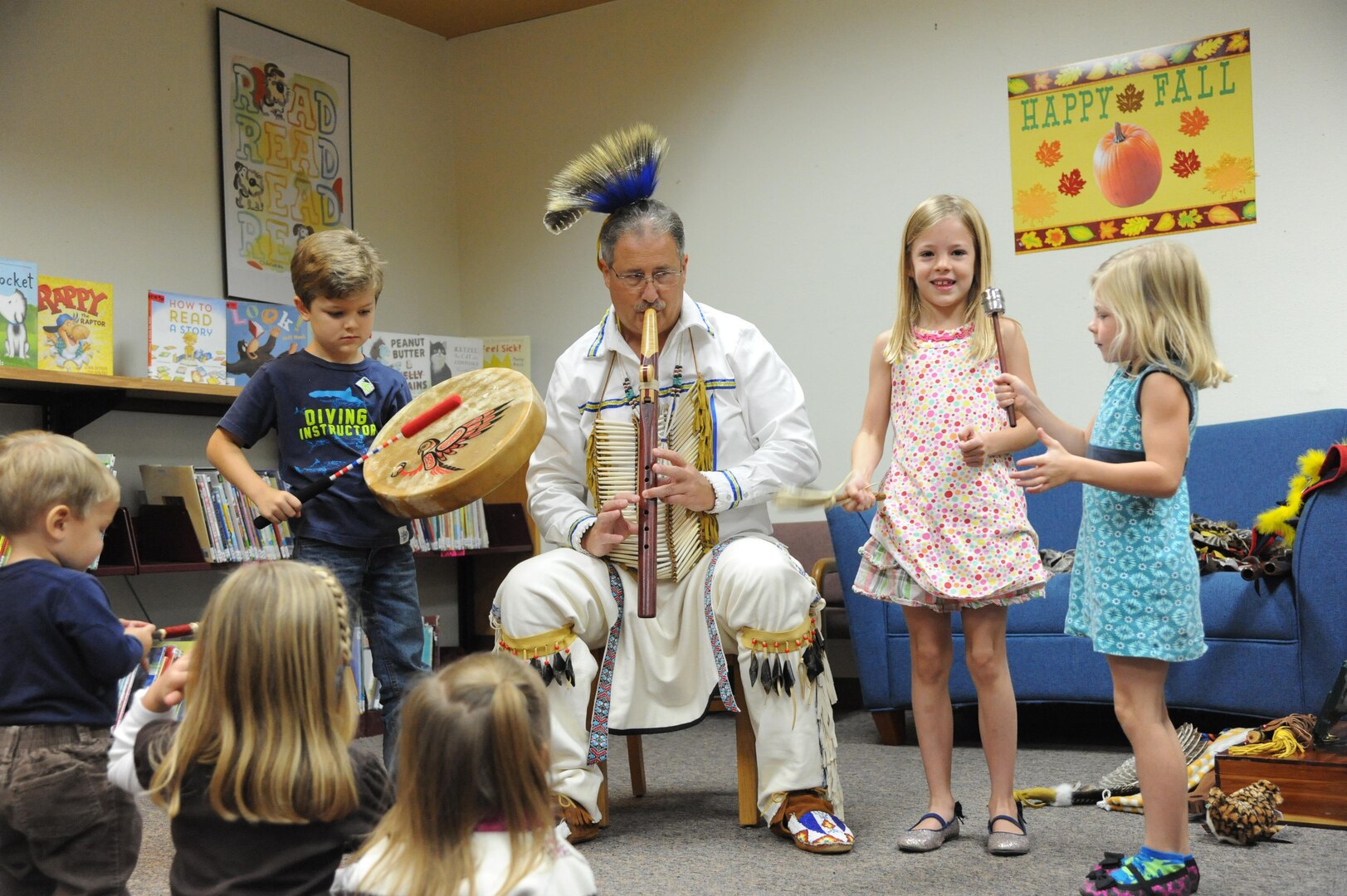 Edward Blauvelt, Joint Base San Antonio-Randolph Native American Indian Heritage Month Committee chairman, shares stories with children Nov.12, 2015 at the JBSA-Randolph library. Throughout November, the nation will celebrate National Native American Indian Heritage Month to recognize the significant contributions Native Americans have made to the establishment and growth of the United States. (U.S. Air Force photo by Melissa Peterson)