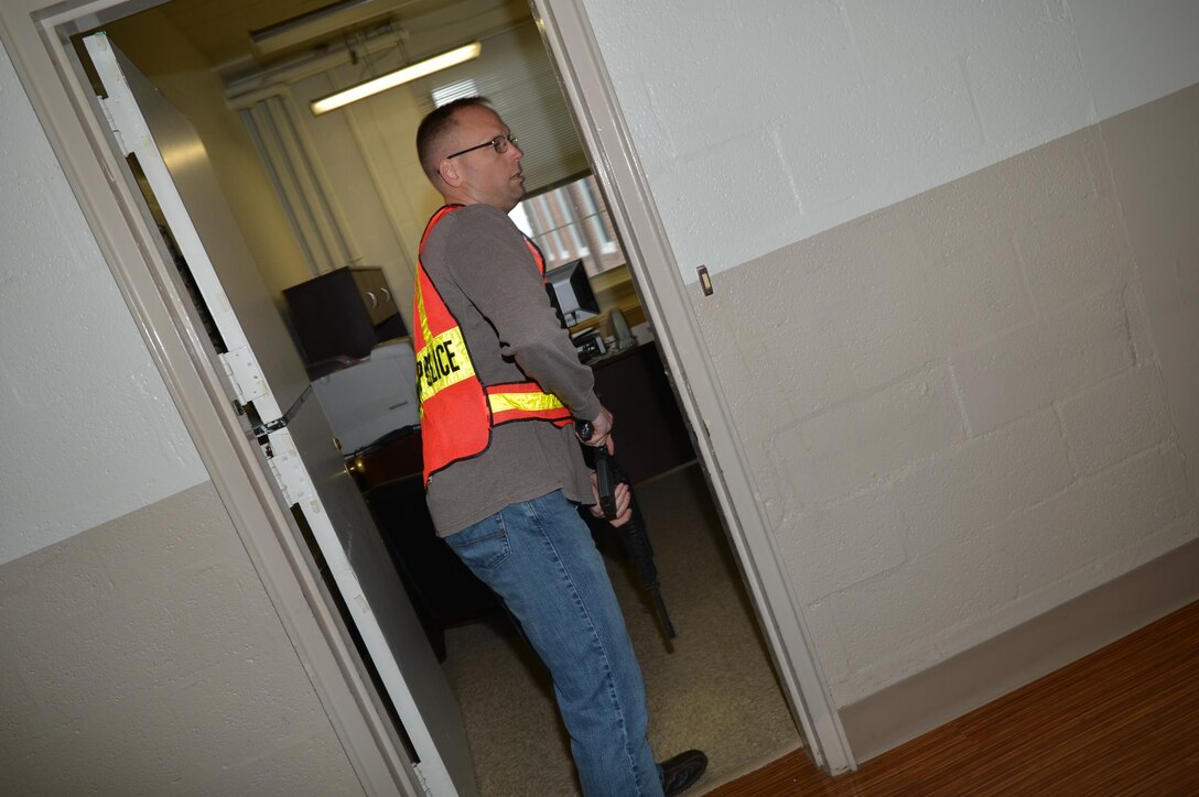 Chief Warrant Officer 2 Benjamin Butler plays the role of an active shooter for a preparedness exercise for employees of Lejeune Hall aboard Marine Corps Base Quantico Nov. 9.