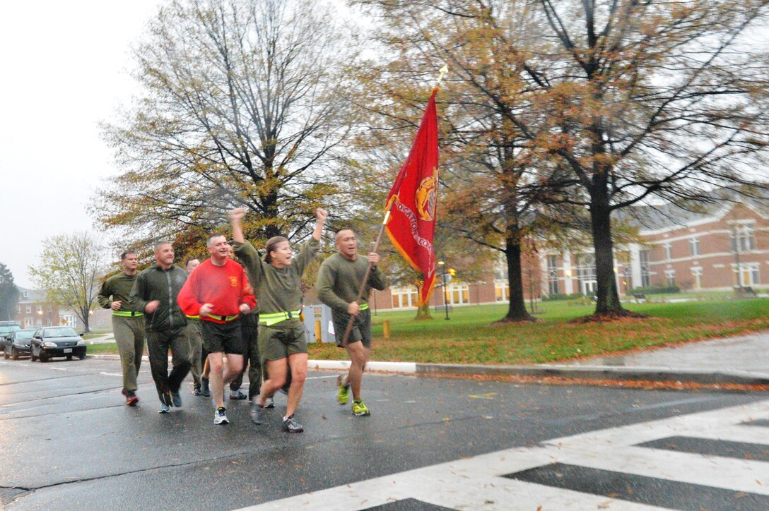 Brig. Gen. Helen Pratt, Marine Corps University president, and Sgt. Major Peter Siaw lead a group of Marines completing the final mile of the 240-mile relay run in honor of the Marine Corps birthday at 7 a.m. on Nov. 10.