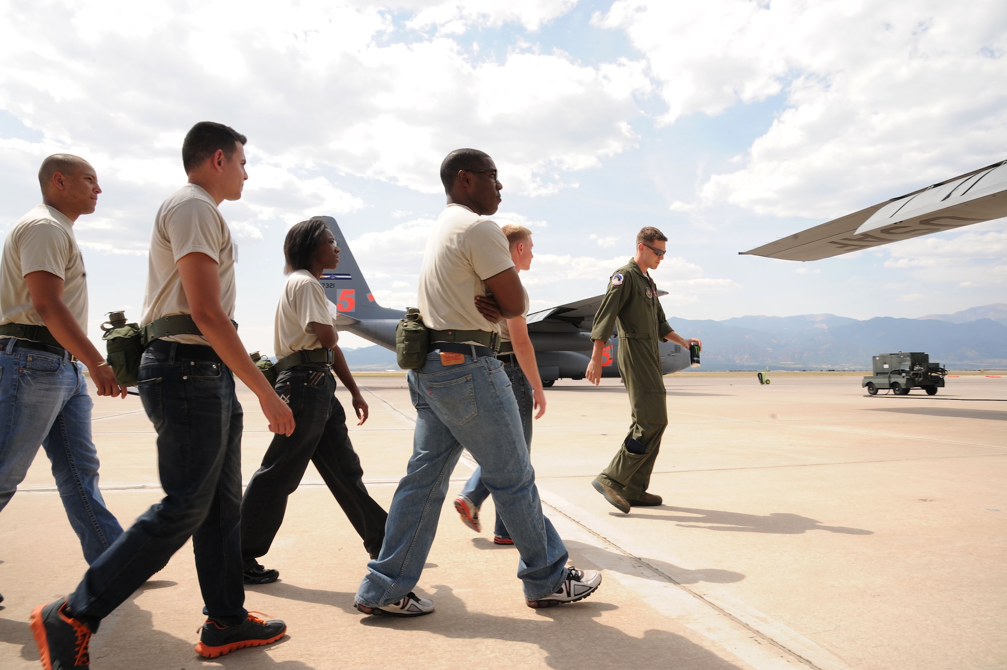 302nd Airlift Wing and 310th Space Wing trainees with the Development and Training Flight get a tour of a C-130 Hercules aircraft during a tour Sept. 13, 2015 at Peterson AFB, Colo. The focus of D&TF is to prepare trainees for basic training, technical school, and an Air Force Reserve career. (U.S. Air Force photo/Senior Airman Amber Sorsek)