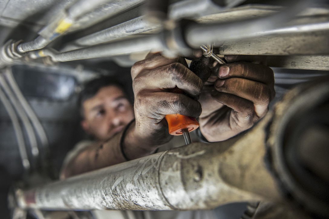 U.S. Air Force Senior Airman Jesse Anocibar removes a bolt on a C-130 Hercules aircraft on Bagram Airfield, Afghanistan, Nov. 13, 2015. Anocibar is a crew chief assigned to the 455th Expeditionary Aircraft Maintenance Squadron. U.S. Air Force photo by Tech. Sgt. Robert Cloys