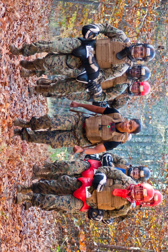 Staff Sgt. Lawanda Ruiz, instructor trainer at the Martial Arts Center of Excellence, trains a squad of Marines in bayonet fighting during the final event to complete Marine Corps Martial Arts Program instructor trainer course at The Martial Arts Center of Excellence at Marine Corps Base Quantico, Virginia, Nov. 4, 2015 . Ruiz has worked at the MACE for one year.