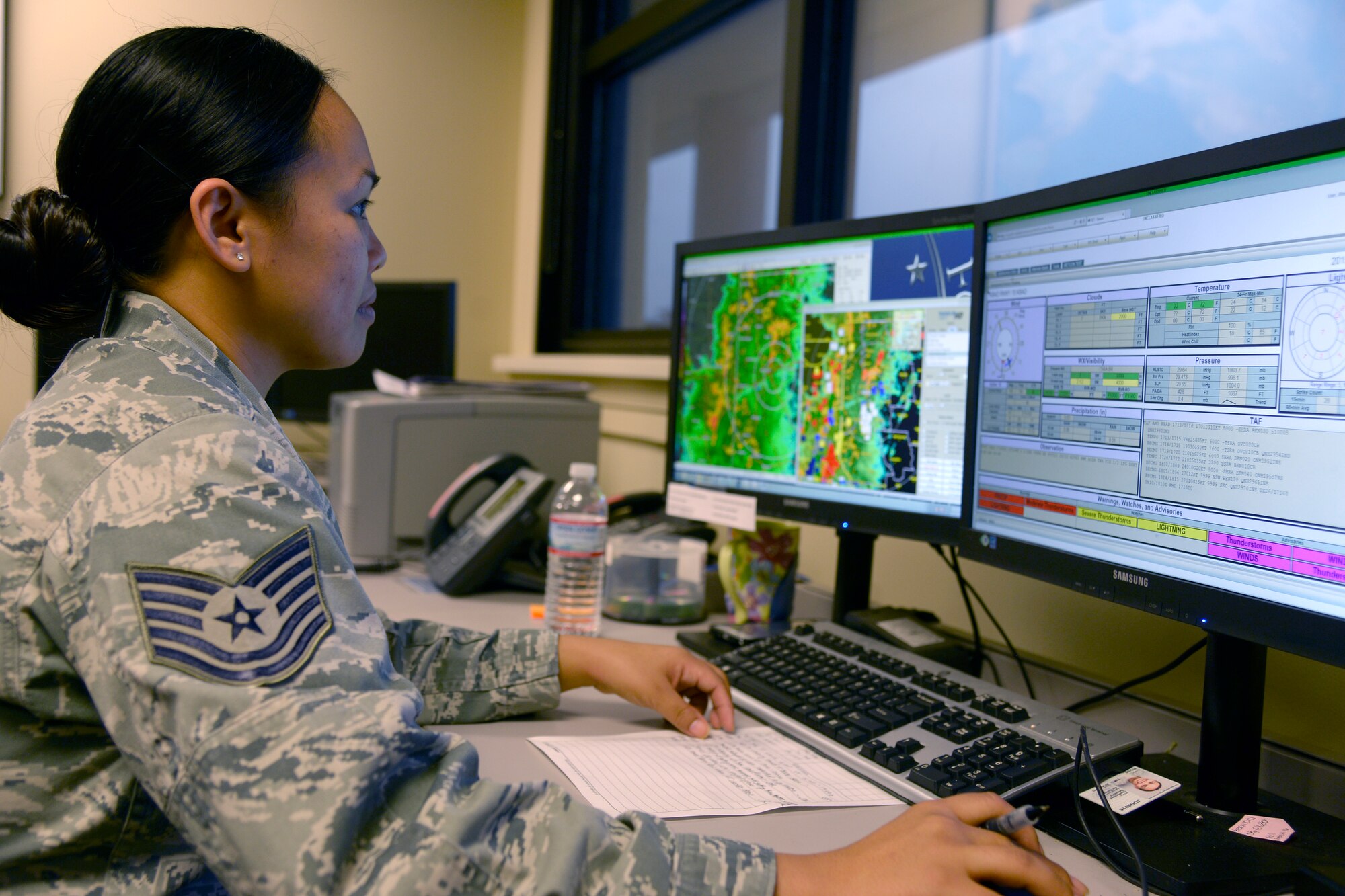 Tech. Sgt. Jaerynne Rose, 2nd Operations Support Squadron weather flight chief, monitors inclement weather patterns at Barksdale Air Force Base, La., Nov. 17, 2015. The 2nd OSS weather section is in charge of forecasting, reporting and briefing aircrew on weather conditions for Barksdale. (U.S. Air Force photo/Tech. Sgt. Marie Brown)