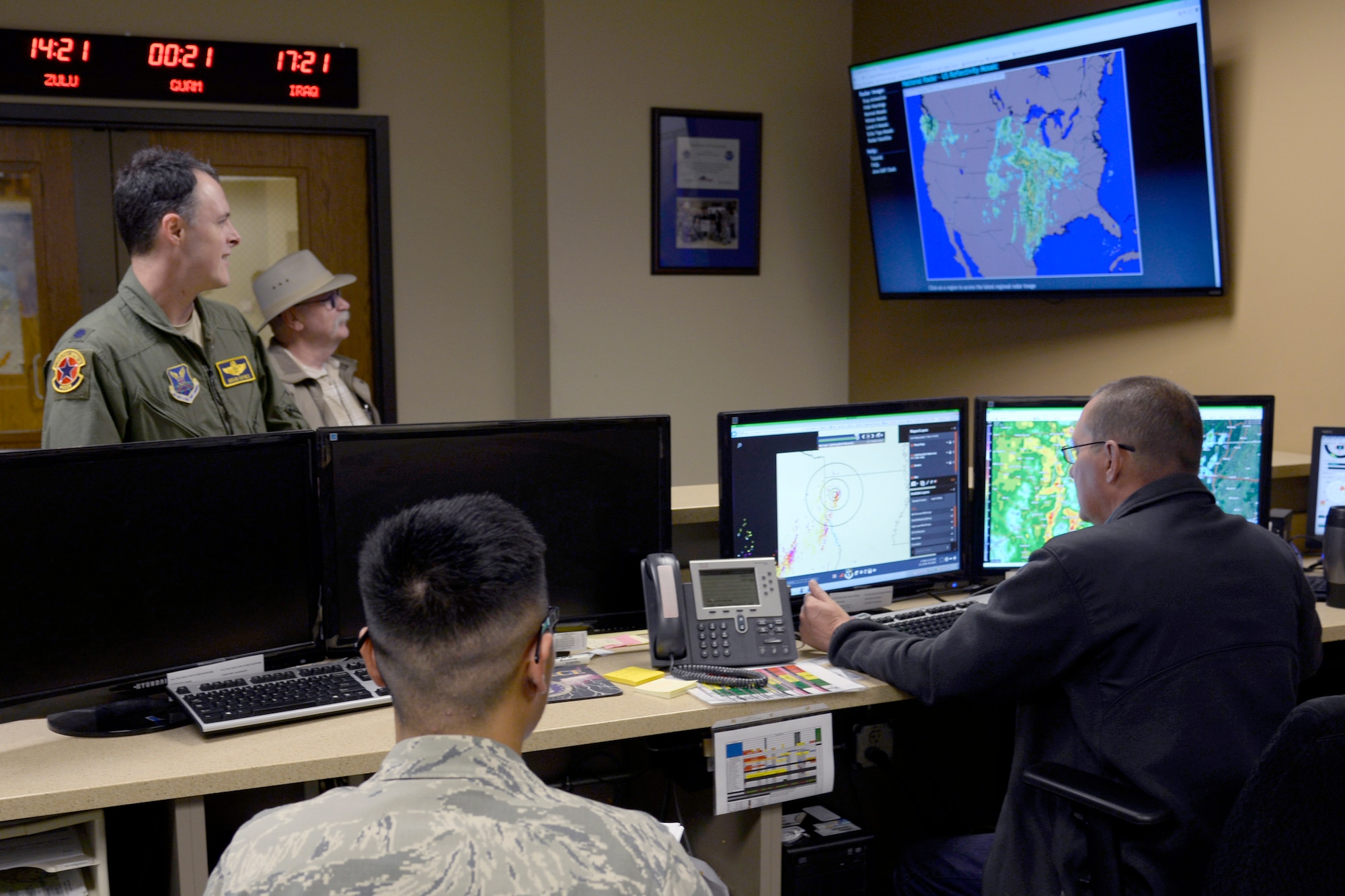 Lorne McClard, 2nd Operations Support Squadron meteorological technician, and Airman 1st Class Alex Syvongsay, 2nd OSS weather apprentice, communicate with members of Team Barksdale about inclement weather approaching Barksdale Air Force Base, La., Nov 17, 2015. The 2nd OSS weather flight’s daily task is to predict the unpredictable and to provide mission essential information to base leadership and aircrew. (U.S. Air Force photo/Tech. Sgt. Marie Brown) 