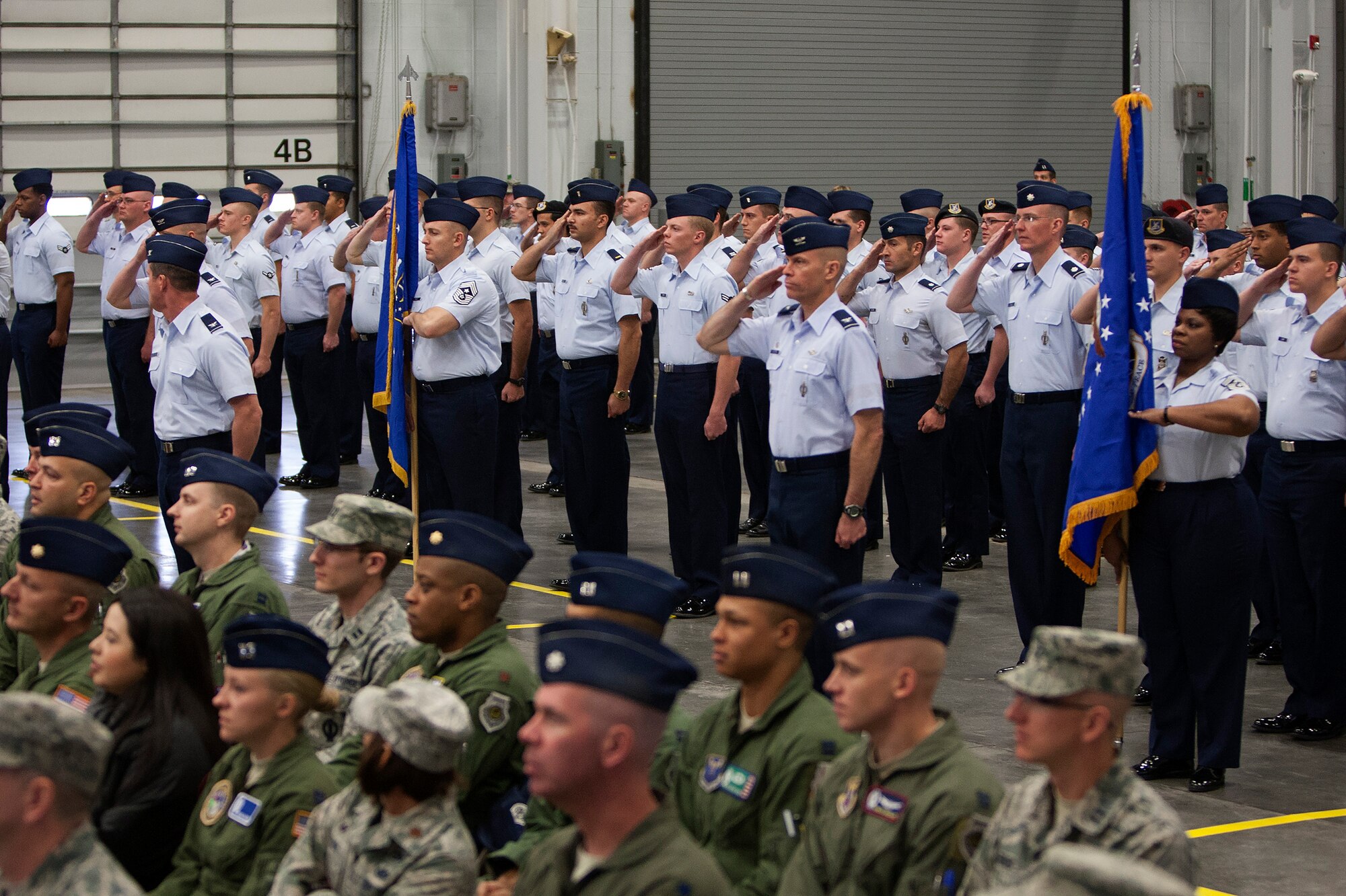 A formation of Airmen renders the first salute to Maj. Gen. Anthony J. Cotton, as Cotton takes command of the 20th Air Force, which is responsible for the nation's three Intercontinental Ballistic Missile wings and one nuclear operations support wing, during a change of command ceremony at F.E. Warren Air Force Base, Nov. 16, 2015. Cotton also assumed command of Task Force 214, which reports to U.S. Strategic Command. TF 214 provides the President of the United States with responsive and highly reliable strategic missile forces, and supports USSTRATCOM's strategic deterrence mission. USSTRATCOM, one of nine DoD unified combatant commands, relies on various task forces for the execution of its global missions, which also include space operations; cyberspace operations; joint electronic warfare; global strike; missile defense; intelligence, surveillance and reconnaissance; combating weapons of mass destruction; and analysis and targeting. (U.S. Air Force photo by Lan Kim)