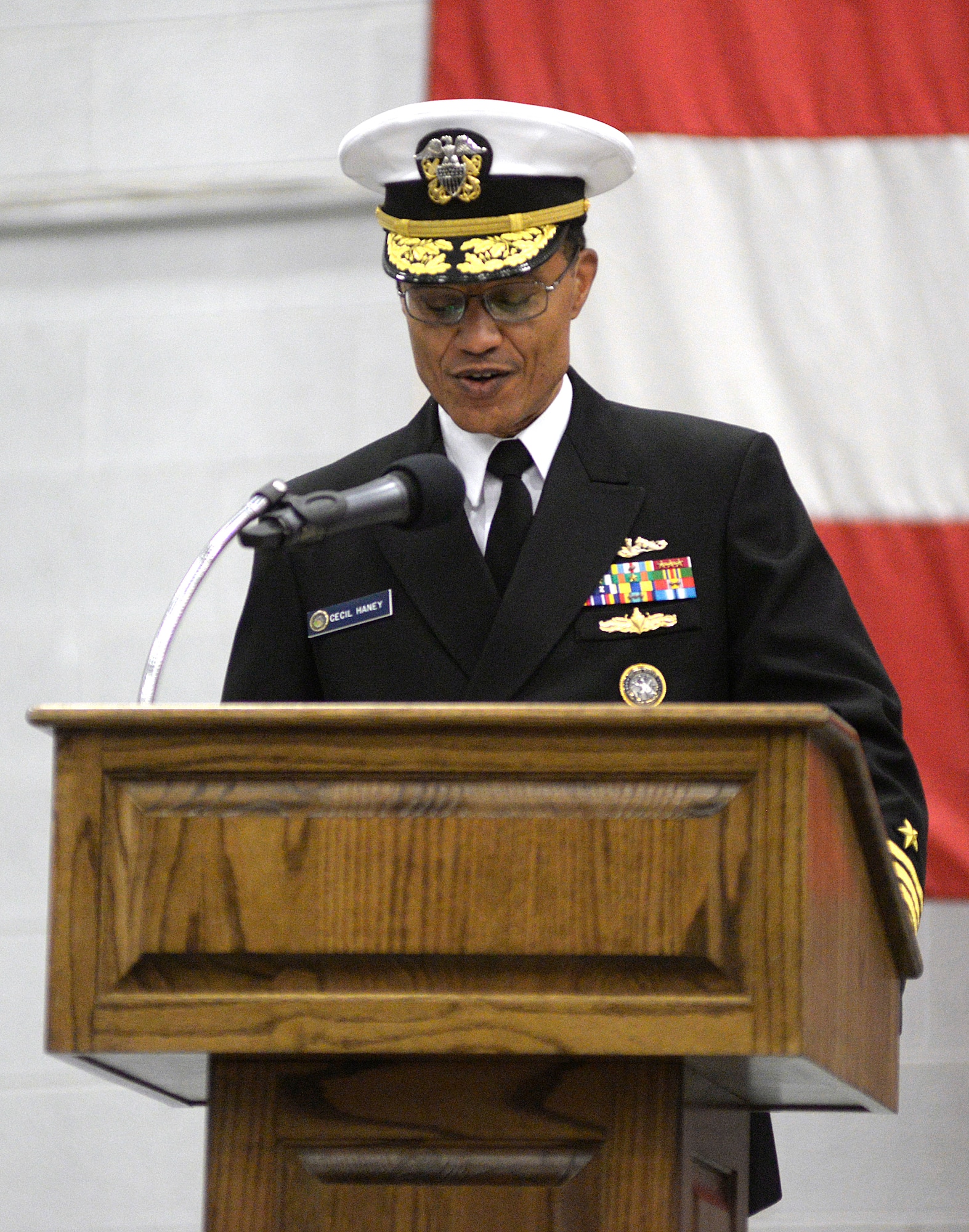 Adm. Cecil D. Haney, U.S. Strategic Command commander, addresses Airmen of the 20th Air Force and Task Force 214 during a change of command ceremony on F.E. Warren Air Force Base, Wyo., Nov. 16, 2015. Maj. Gen. Anthony J. Cotton assumed command of the two units during the ceremony. Task Force 214 is a USSTRATCOM component, while the 20th Air Force is part of Air Force Global Strike Command. TF 214 provides the President of the United States with responsive and highly reliable strategic missile forces, and supports USSTRATCOM's strategic deterrence mission by operating and maintaining the Air Force's Intercontinental Ballistic Missile force. One of nine DoD unified combatant commands, USSTRATCOM has global strategic missions, assigned through the Unified Command Plan, which also include space operations; cyberspace operations; joint electronic warfare; global strike; missile defense; intelligence, surveillance and reconnaissance; combating weapons of mass destruction; and analysis and targeting.  (U.S. Air Force photo by R.J. Oriez/Released)