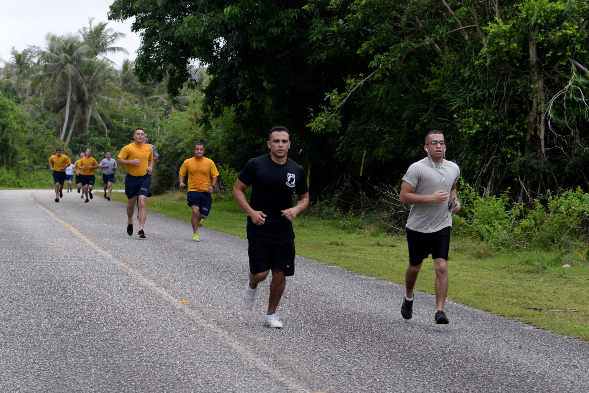 Service members and families run in the Turkey Trot 5K Nov. 18, 2015, at Andersen Air Force Base, Guam. More than 200 runners took to the road to celebrate Thanksgiving during the event sponsored by the 36th Force Support Squadron. (U.S. Air Force photo by Airman 1st Class Alexa Ann Henderson/Released) 