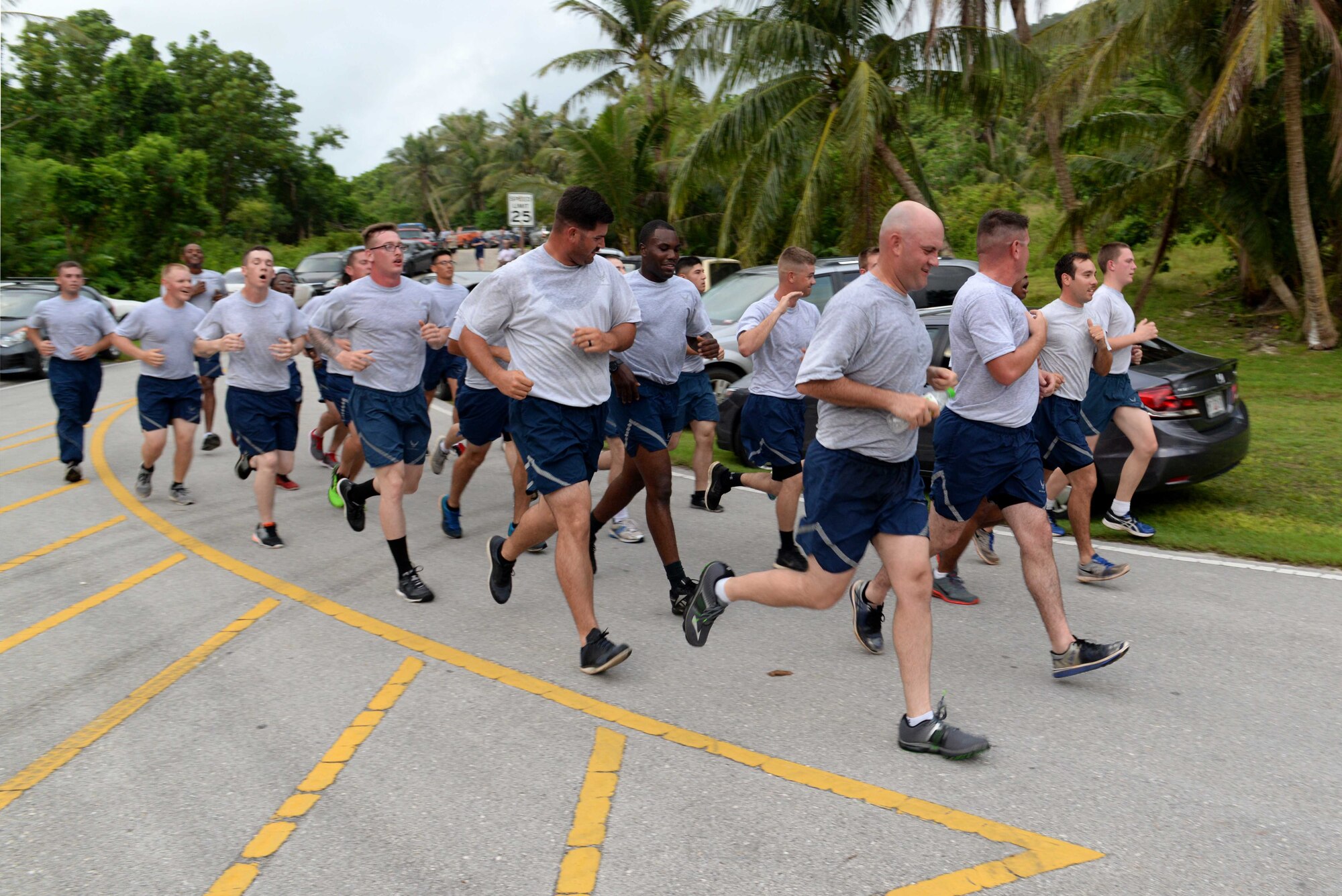 A formation of Airmen runs in the Turkey Trot 5K Nov. 18, 2015, at Andersen Air Force Base, Guam. The 36th Force Support Squadron held the event to celebrate Thanksgiving, drawing more than 200 participants. (U.S. Air Force photo by Airman 1st Class Alexa Ann Henderson/Released)