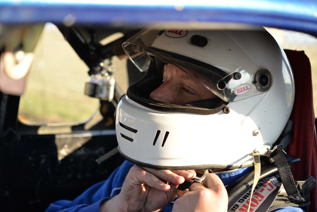 Tech. Sgt. Cameron Sogge, 82nd Training Group unit deployment manager and B-52 Stratofortress maintainer, straps into his B-52 legend car before racing in the Legends Semi-Pro Championship at the Texas Motor Speedway in Fort Worth, Texas, Oct. 3, 2015. Sogge began racing around age 16 and continued to race throughout his Air Force career, winning the championship in 2015. (U.S. Air Force photo/Senior Airman Kyle Gese)