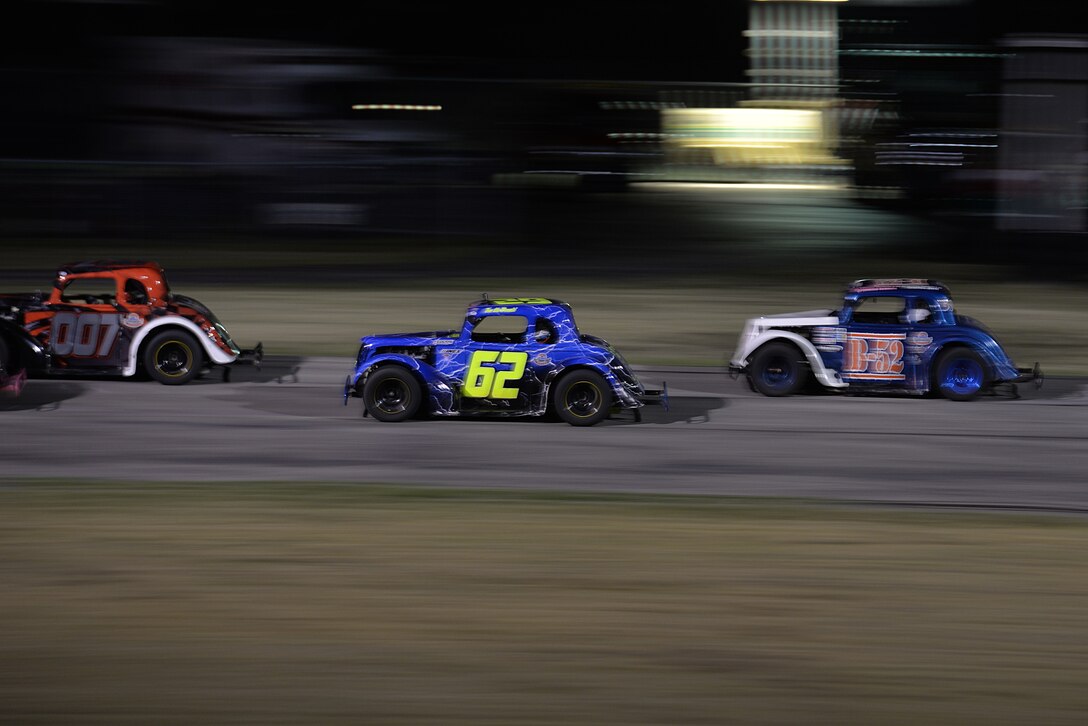Tech. Sgt. Cameron Sogge, 82nd Training Group unit deployment manager and B-52 Stratofortress maintainer, catches up to 007 – Sogge’s competitor for the Legends Semi-Pro Championship race at the Texas Motor Speedway in Fort Worth, Texas, Oct. 3, 2015. Sogge won the championship after 007 removed himself from the race, due to an accident. (U.S. Air Force photo/Senior Airman Kyle Gese)