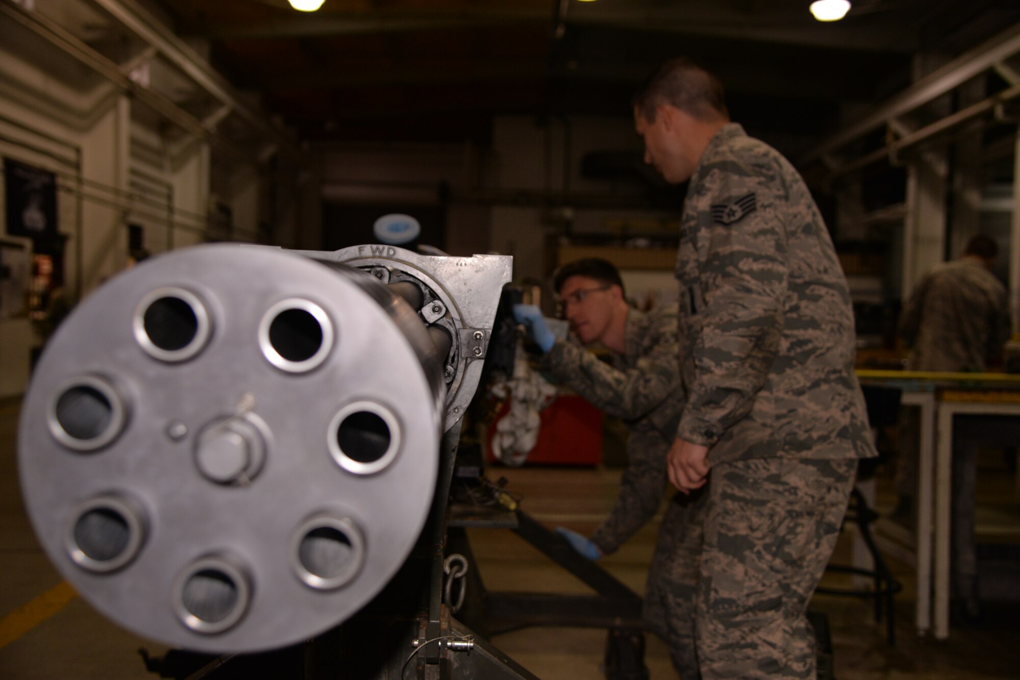 Staff Sgt. Cody Hamilton, 51st Munitions Squadron aircraft armament systems journeyman, and Airman 1st Class John Gaddis, 51st MUNS aircraft armament systems apprentice, perform a system check on a GAU-8 30mm gun Nov. 18, 2015, at Osan Air Base, Republic of Korea. Airmen assigned to the 51st MUNS armament flight inspect the 30-mm gun, feed and handling system, ammunition loading adaptor and triple ejector rack for possible malfunctions or maintenance issues. (U.S. Air Force photo/Staff Sgt. Benjamin Sutton)