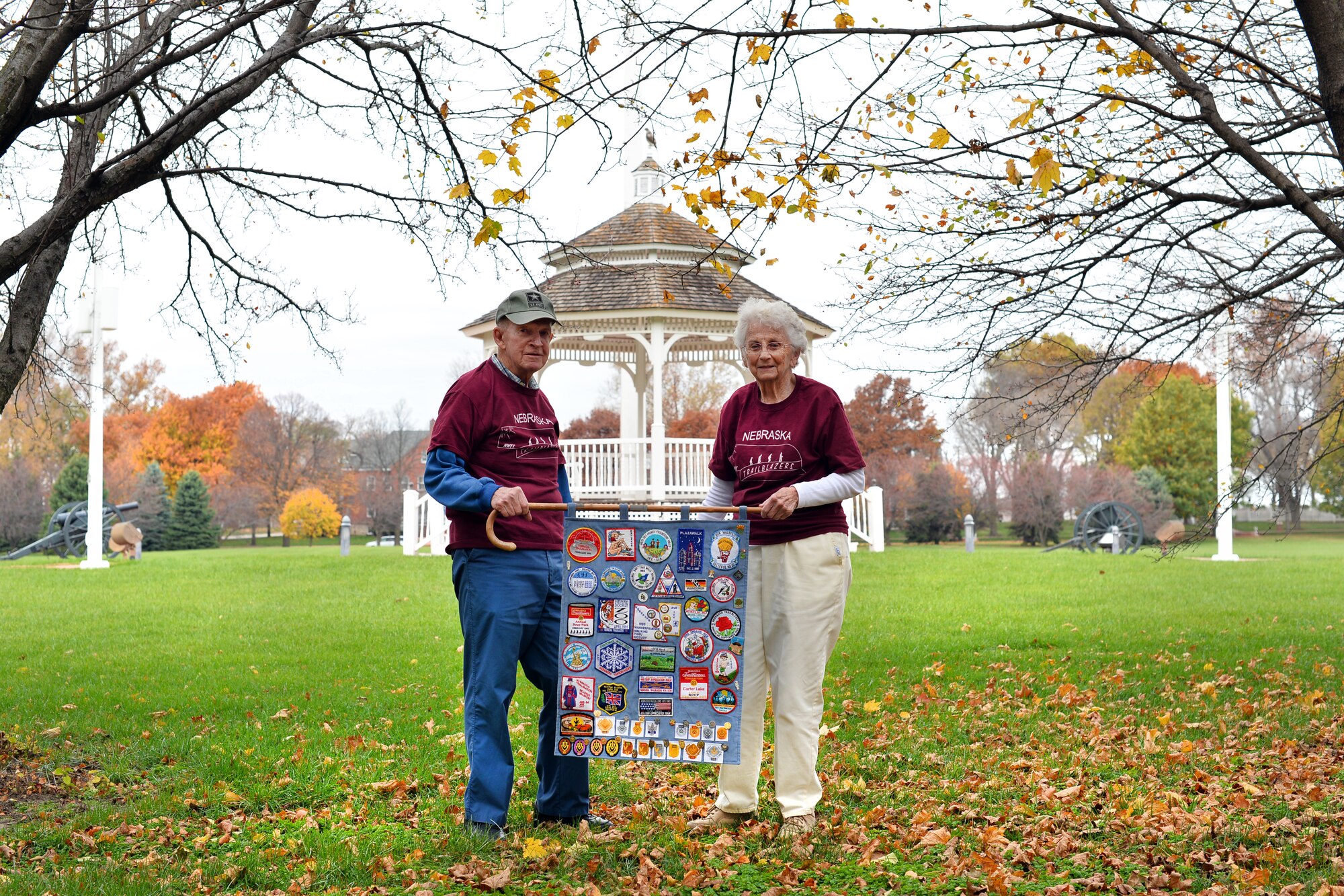 Jim and Sheila Goeltz proudly display a collection of pins and patches earned through their 44-year involvement with the American Volkssport Association on Nov. 6, Offutt Air Force Base, Neb.  They were introduced to the budding Volksport community while stationed in Germany in 1971.  They’ve been members of what is referred to as Volksmarching ever since.  (U.S. Air Force photo by Josh Plueger/Released)