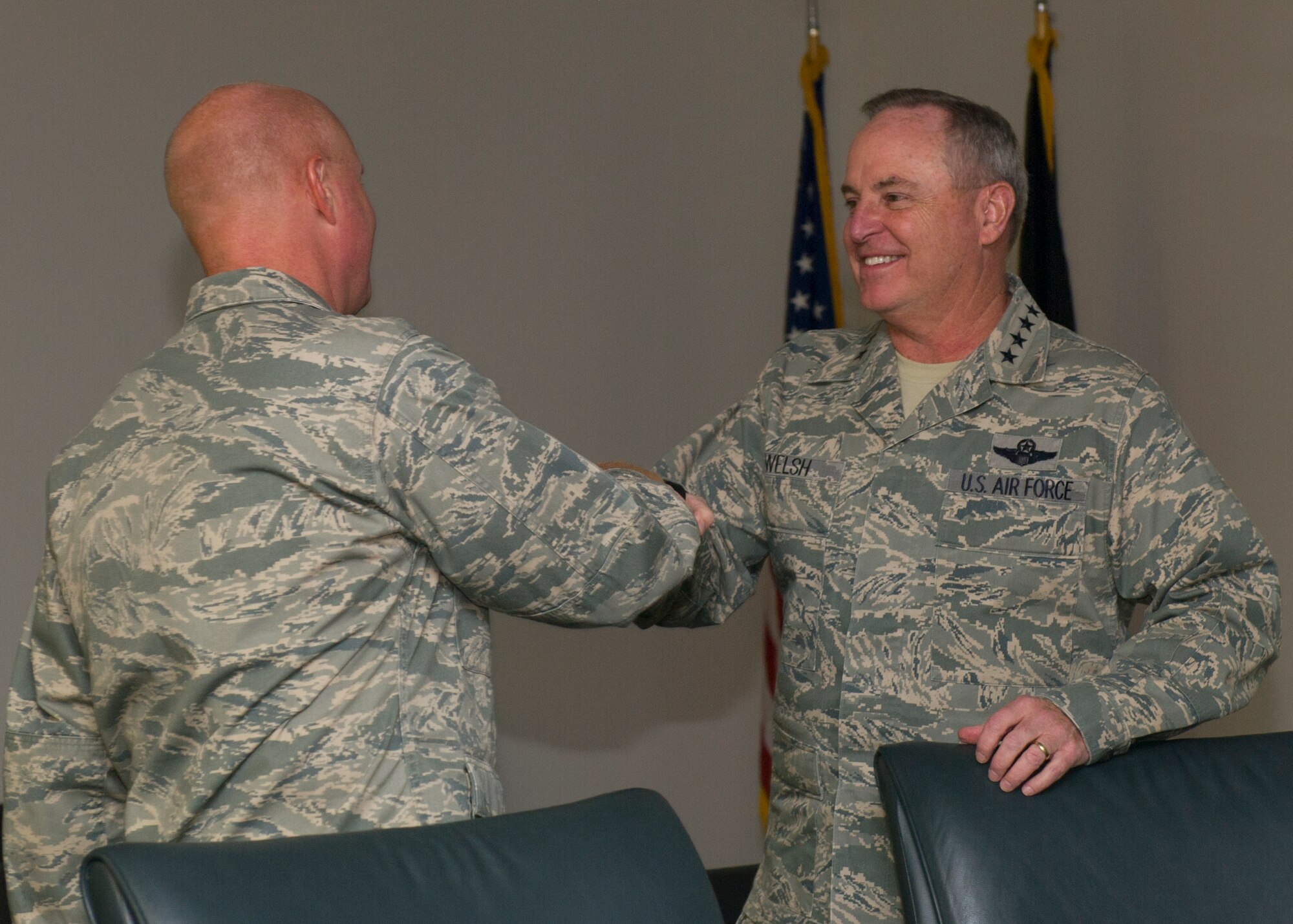 Air Force Chief of Staff Gen. Mark A. Welsh lll greets Col. Joseph Moehlmann, the 49th Materiel Maintenance Group commander, during his visit to Holloman Air Force Base, New Mexico on Nov. 16. During his visit, members of Team Holloman provided tours and briefings highlighting the unique missions Holloman sustains every day. Welsh also had the opportunity to review Air Force needs, requirements and investments with a sustained focus on successes and challenges Airmen face today. Welsh was joined by his wife, Betty Welsh, who addressed top Air Force issues such as suicide prevention, resiliency, exceptional family member programs and sexual assault. (U.S. Air Force photo by Senior Airman Leah Ferrante) 