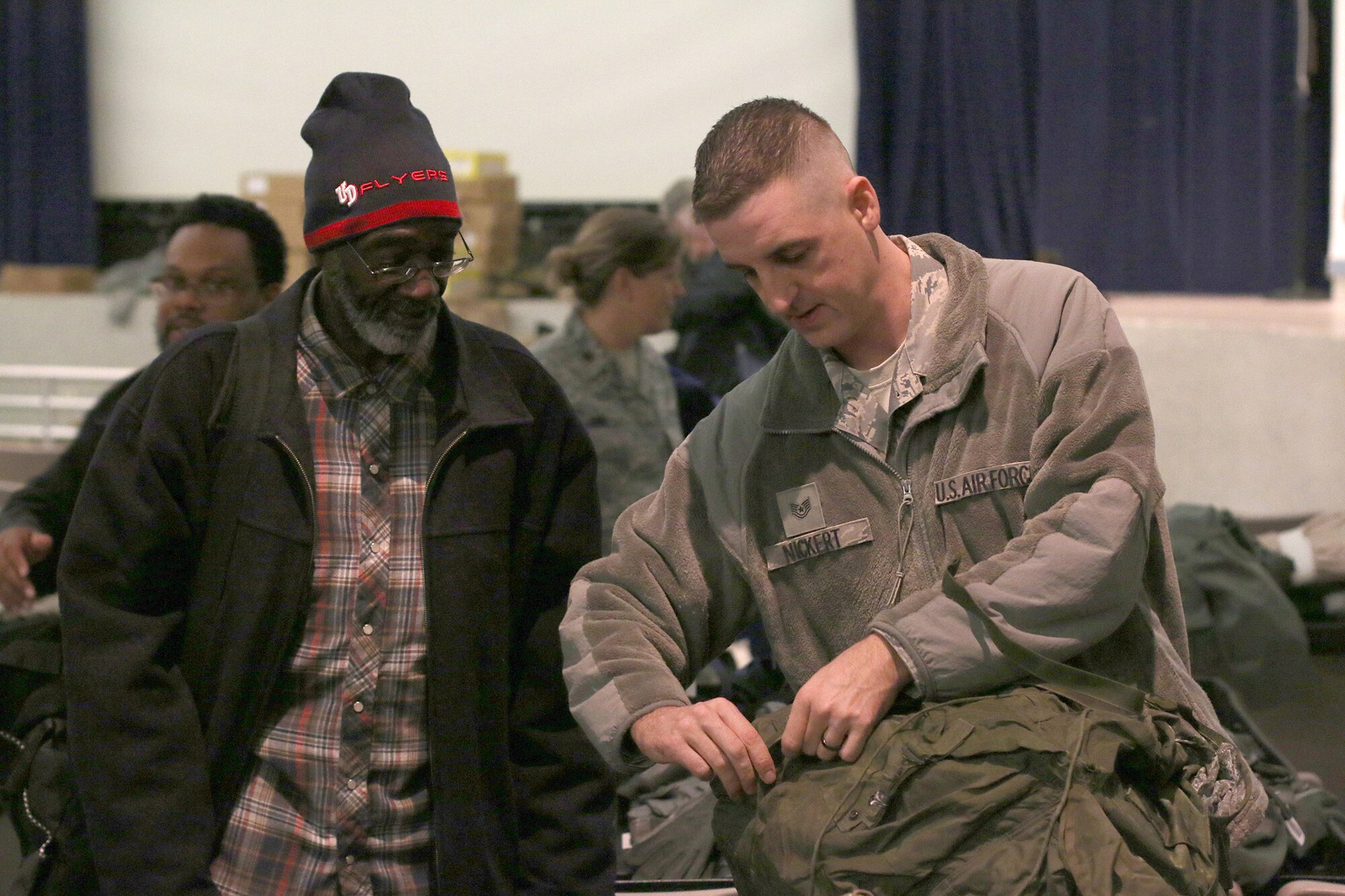 DAYTON, Ohio – Technical Sgt. Nicholas Nickert, 445th Aircraft Maintenance Squadron avionics technician, assists veterans during the Dayton Veterans Affair’s Medical Center Homeless Stand down October 29, 2015.  More than 10 members of the 445th Airlift Wing volunteered for the event. This year’s homeless stand down provided  a meal, clothing, health screenings, VA and Social Security benefits counseling, and referrals to a variety of other necessary services, such as: housing, employment, substance abuse and mental health treatment services to more than 300 veterans. The purpose of the event is to raise awareness for the difficulty in which Veterans and their families endure.  (U.S. Air Force photo /Tech. Sgt. Patrick O’Reilly)