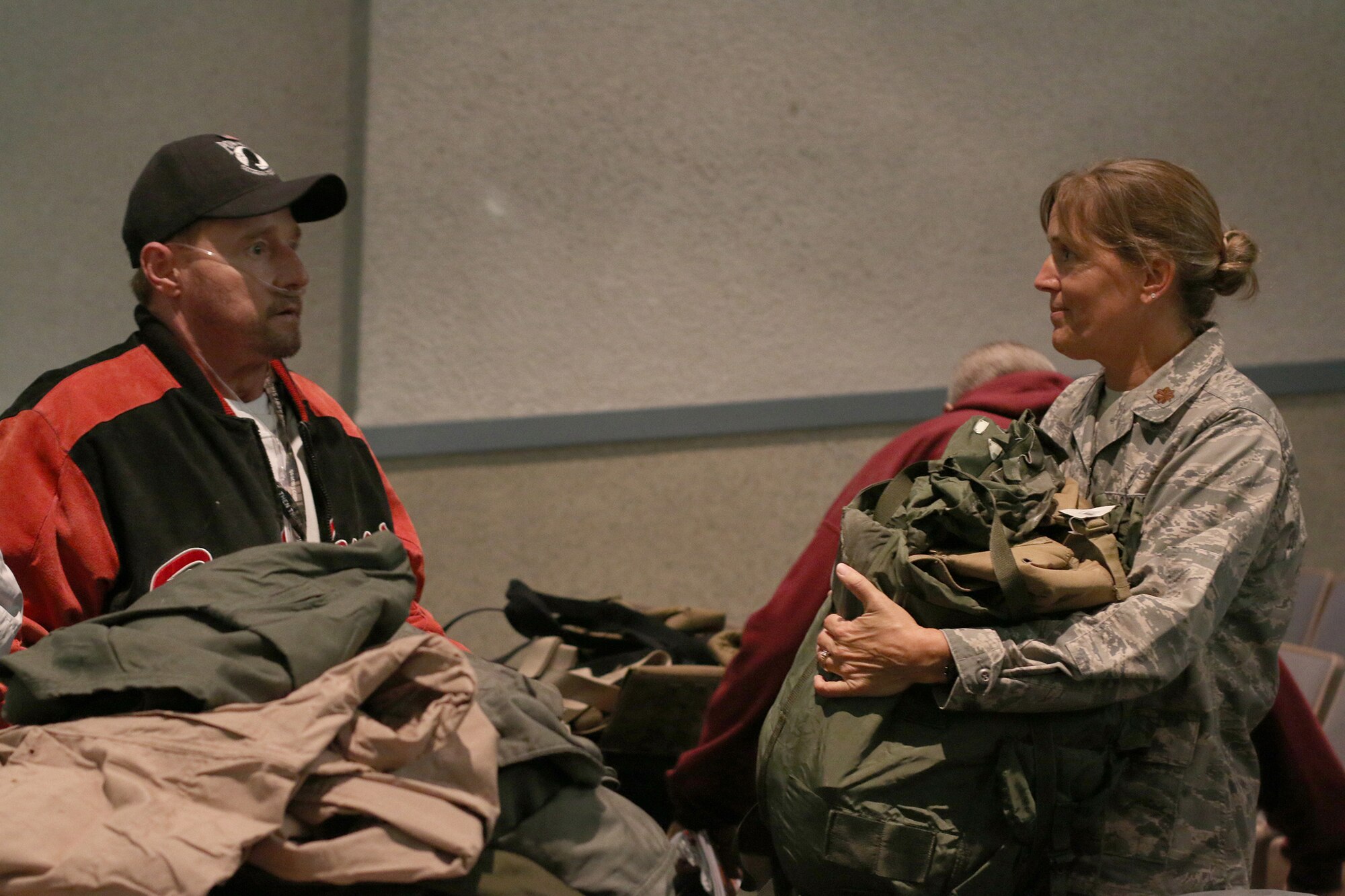 DAYTON, Ohio – Maj. Kimberly Ebel, 445th Aeromedical Staging Squadron, assists veterans during the Dayton Veterans Affair’s Medical Center Homeless Stand down October 29, 2015.  More than 10 members of the 445th Airlift Wing volunteered for the event. This year’s homeless stand down provided  a meal, clothing, health screenings, VA and Social Security benefits counseling, and referrals to a variety of other necessary services, such as: housing, employment, substance abuse and mental health treatment services to more than 300 veterans. The purpose of the event is to raise awareness for the difficulty in which Veterans and their families endure.   (U.S. Air Force photo /Tech. Sgt. Patrick O’Reilly)
