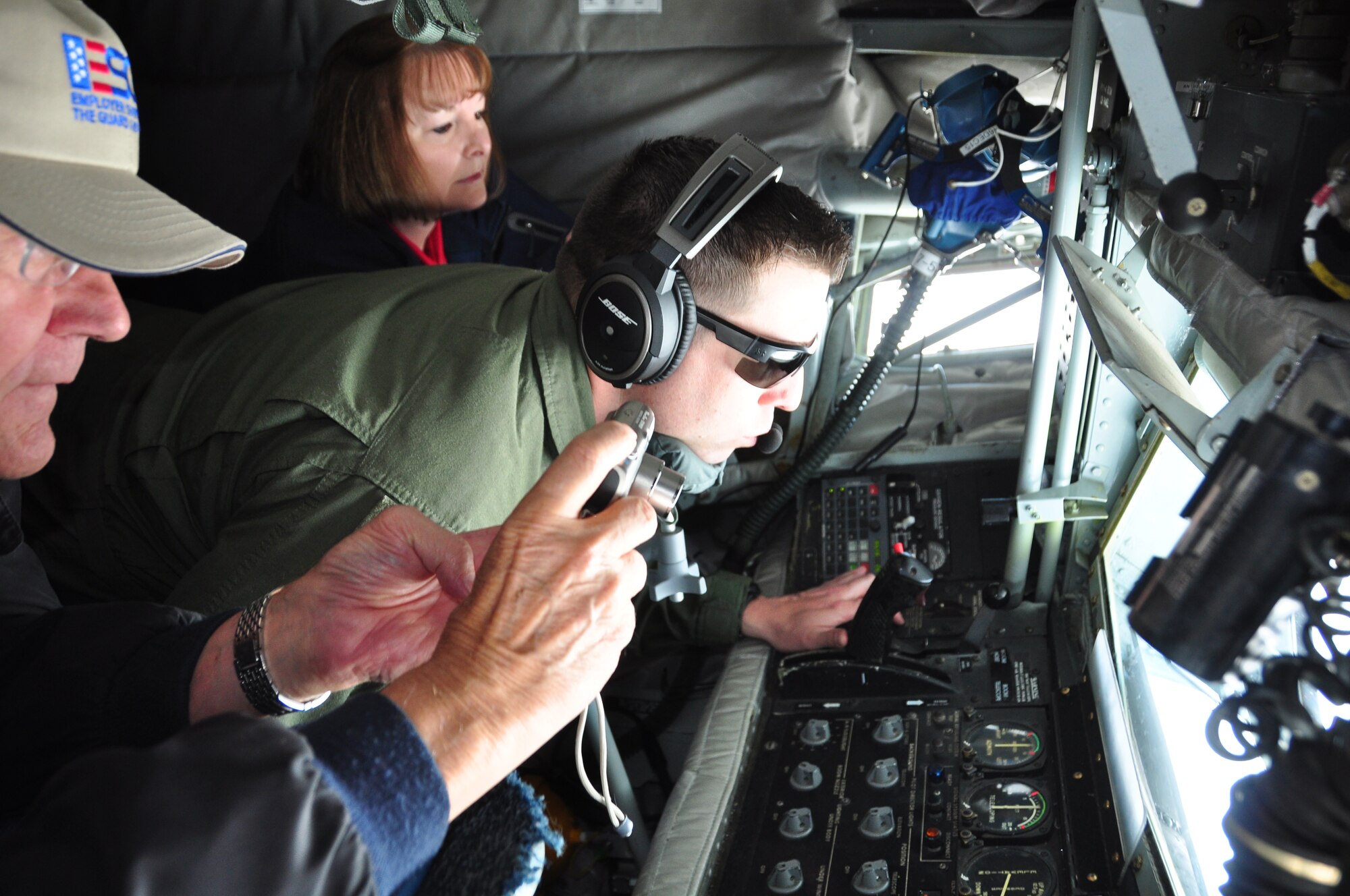 Gary Phleiger, Wells Fargo vice president (left), and Beverly Rodriguez, USAA human resources (center), experience their first mid-air refueling as Staff Sgt. Bryan Lampinen, 434th Air Refueling Wing boom operator, provides guidance to the 301st Fighter Wing’s F-16s. In conjunction with Employer Support for the Guard and Reserve, 20 local civic leaders and employers took part in a two-day adventure to Tyndall AFB, Fla., visiting with the 44th Fighter Group, 325 Fighter Wing and 601st Air Operations Center there. (U.S. Air Force photo/Julie Briden-Garcia)