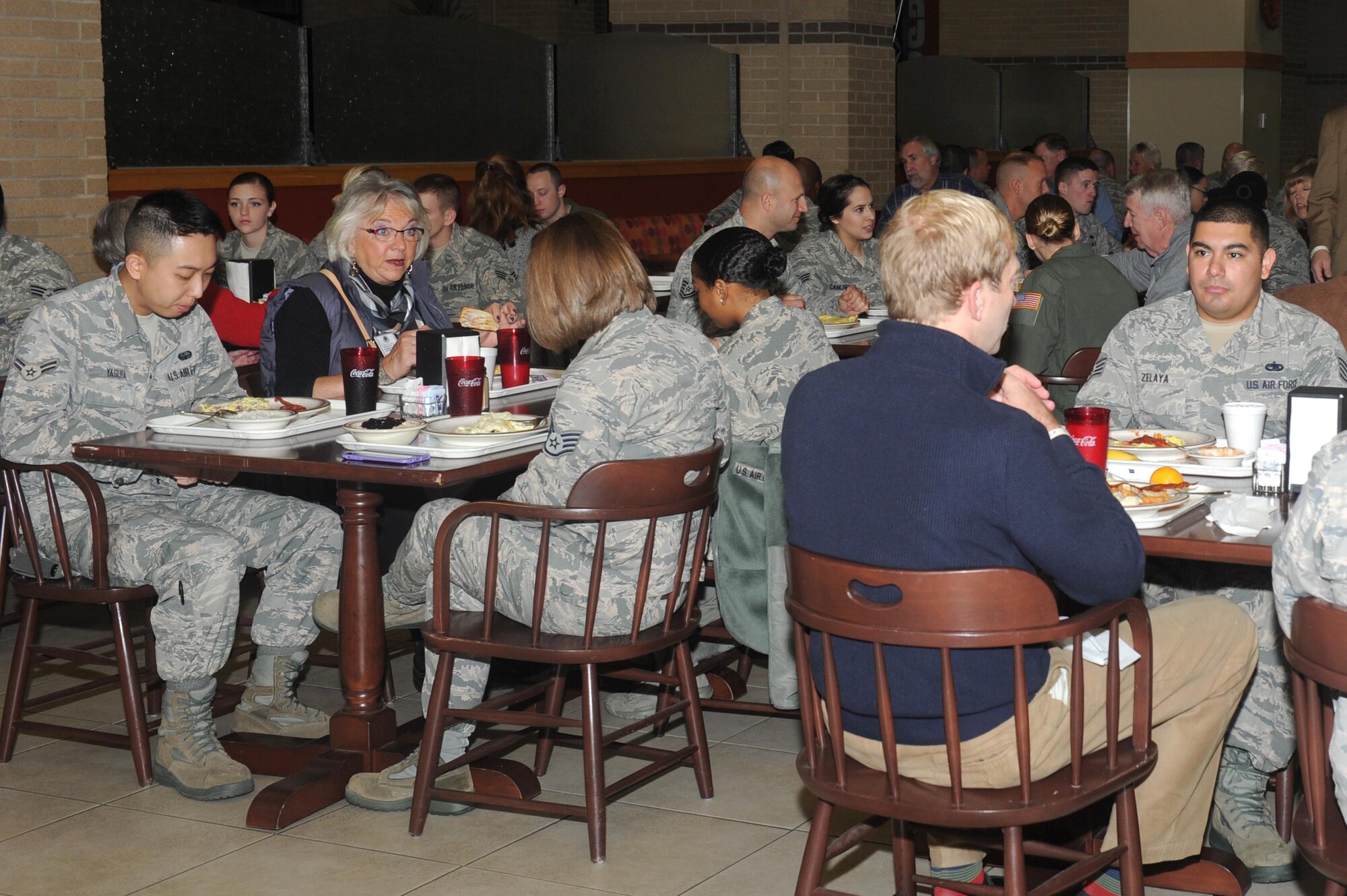 Air Mobility Command civic leaders eat breakfast with Airmen assigned to various units of the 22nd Air Refueling Wing, Nov. 17, 2015, at McConnell Air Force Base, Kan. The breakfast was part of a base tour in which community leaders learned about the base, its aerial refueling mission and the Airmen who work to make it happen. (U.S. Air Force photo/Senior Airman Tara Fadenrecht)