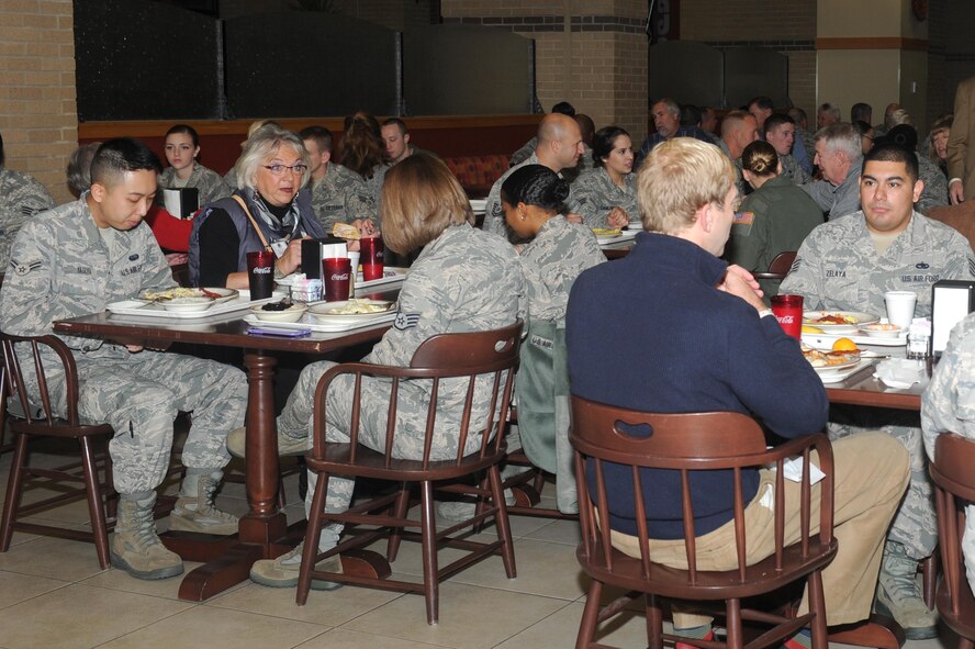Air Mobility Command civic leaders eat breakfast with Airmen assigned to various units of the 22nd Air Refueling Wing, Nov. 17, 2015, at McConnell Air Force Base, Kan. The breakfast was part of a base tour in which community leaders learned about the base, its aerial refueling mission and the Airmen who work to make it happen. (U.S. Air Force photo/Senior Airman Tara Fadenrecht)