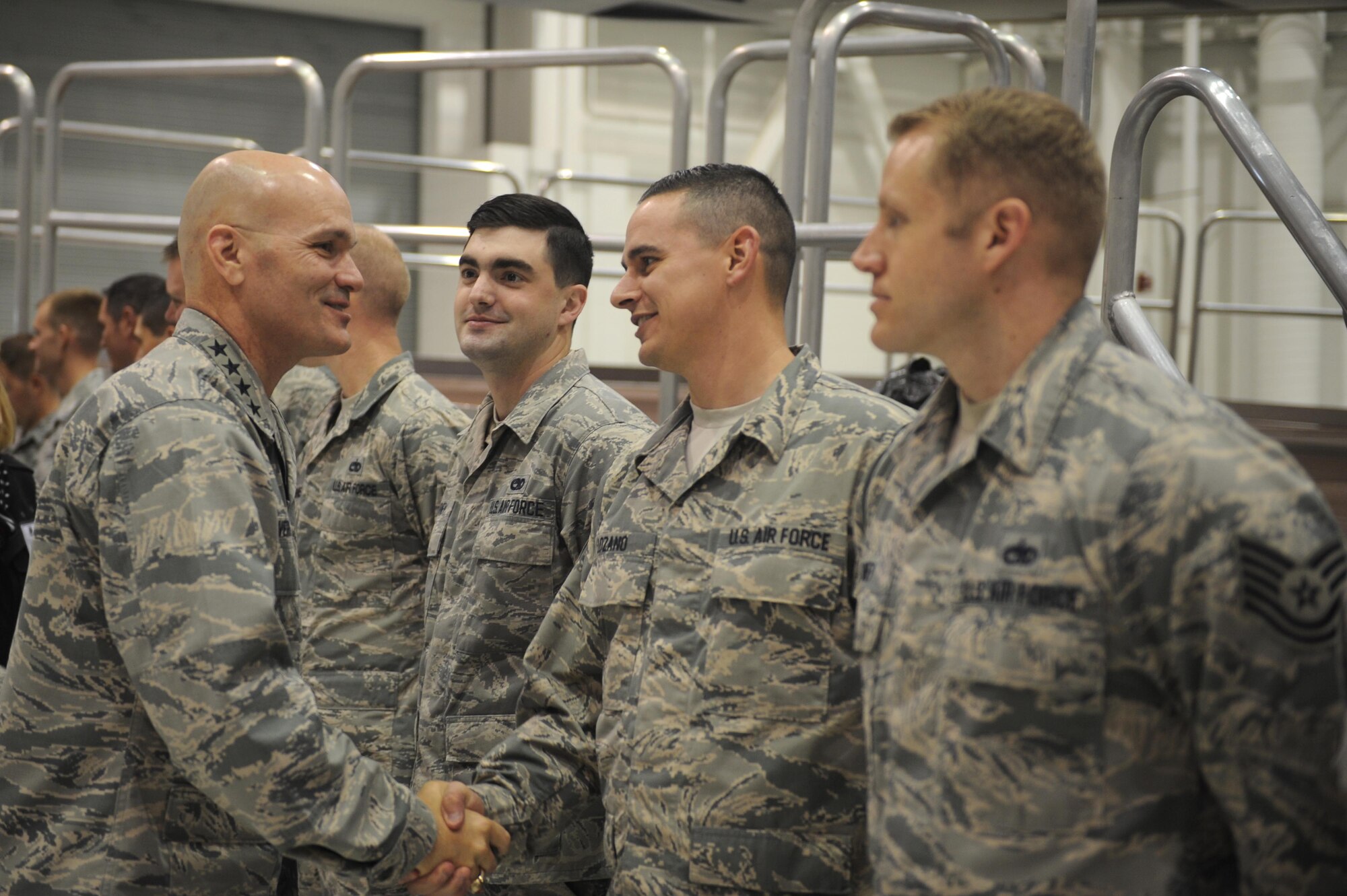 General Carlton Everhart, Air Mobility Command commander, greets Team McConnell maintenance Airmen, Nov. 17, 2015, at McConnell Air Force Base, Kan. Everhart joined AMC civic leaders on a tour of the base to showcase the wing’s current aerial refueling mission with the KC-135 Stratotanker and future home of the KC-46 Pegasus. Everhart used the tour as an opportunity to thank Airmen for their hard work and dedication. (U.S. Air Force photo/Senior Airmen Tara Fadenrecht)