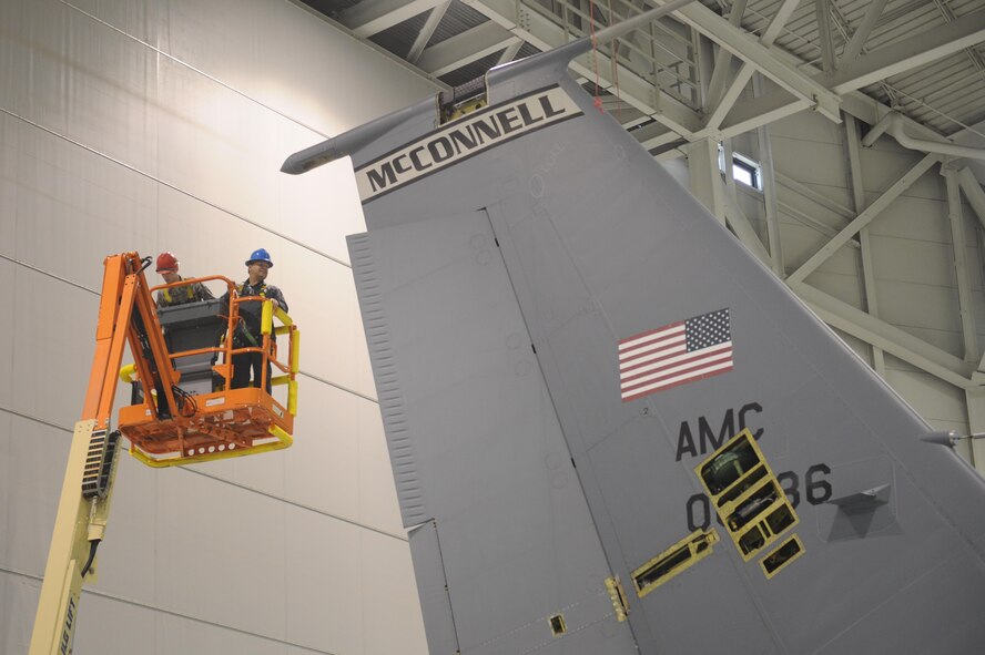 A 22nd Maintenance Group Airman escorts an Air Mobility Command civic leader to the top of a KC-135 Stratotanker to give an inside look at what goes into maintaining a tanker, Nov. 17, 2015, at McConnell Air Force Base, Kan. The event was part of a three-day AMC civic leader tour of McConnell in which attendees learned about the base’s current mission with the KC-135s and the future home of the KC-46 Pegasus. (U.S. Air Force photo/Senior Airman Tara Fadenrecht)
