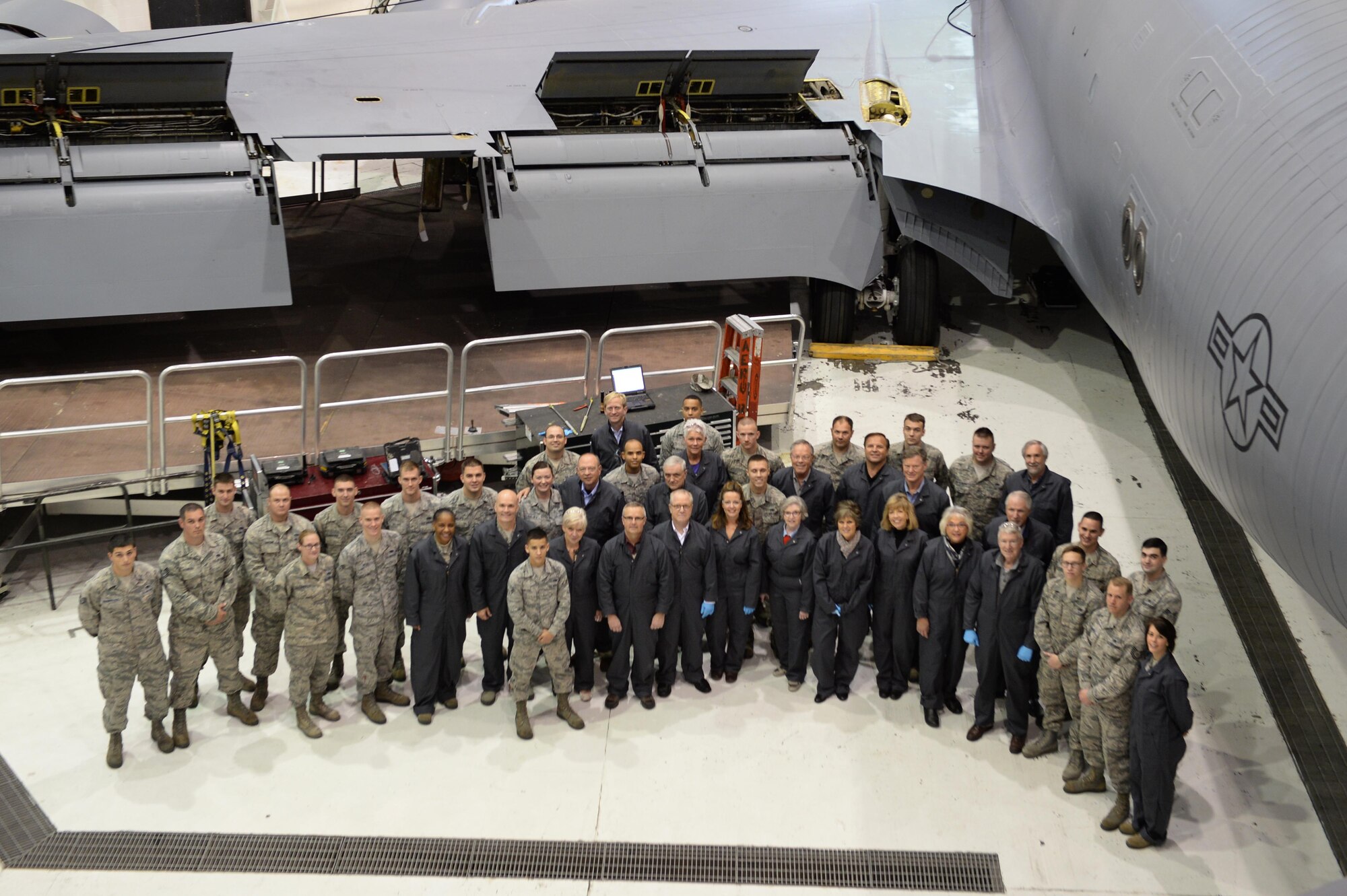 Air Mobility Command leadership and civic leaders pose with 22nd and 931st Maintenance Group Airmen next to a KC-135 Stratotanker, Nov. 17, 2015, at McConnell Air Force Base, Kan. Each civic leader was paired with an Airman who showed them first-hand what goes into maintaining a 60-year-old aircraft.  The event was part of a three-day AMC civic leader tour of McConnell in which attendees learned about the base’s current mission with the KC-135s and the future home of  the KC-46 Pegasus. (U.S Air Force photo/Senior Airman Colby Hardin)