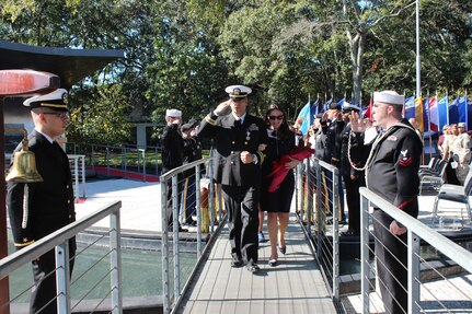 Lieutenant Commander Seifert and his wife, Janna, are piped ashore during his retirement ceremony on Oct. 30, 2015 at the Navy Memorial Amphitheater in North Charleston, S.C. Seifert’s 23 year career  included assignments as Food Service Officer, Logistics, Plans and Policy Officer, Force Ordnance Officer, JTF-HOA Operations Logistics Officer, Instructor/Clearance Officer, Naval Postgraduate School.