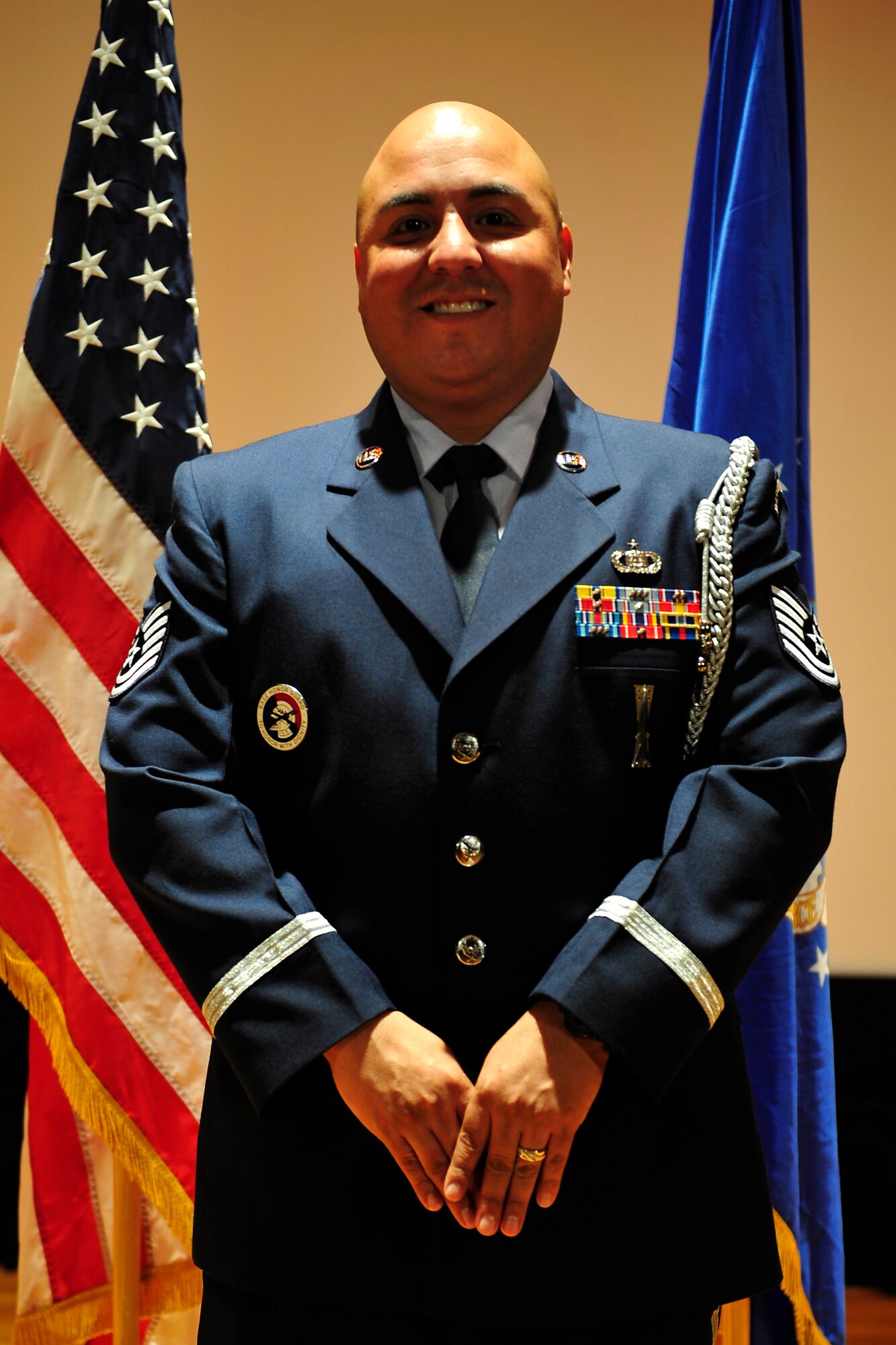 U.S. Air Force Tech. Sgt. Richard Vasquez, Jr., Air Combat Command Heritage Band of America vocalist and base honor guard manager, stands at ceremonial parade rest after an honor guard graduation at Langley Air Force Base, Va., Nov. 10, 2015. As a base honor guard manager, Vasquez is in charge of making sure the honor guard members are “sharp, crisp and motionless,” as stated in their creed. (U.S. Air Force photo by Senior Airman Breonna Veal)