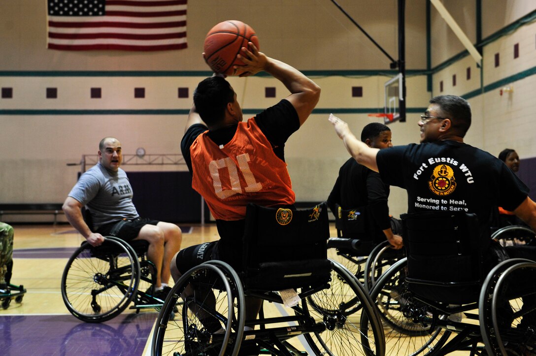 U.S. Army Staff Sgt. Samuel Melendez, a member assigned to the Alpha Company Warrior Transition Unit, shoots a basketball during a wheelchair basketball game at McClellan Fitness Center at Fort Eustis, Va., Nov. 13, 2015. The WTU’s goal is to provide support to wounded, ill and injured Soldiers who require at least six months of rehabilitative care and medical management to transition back to Army or civilian status. (U.S. Air Force photo by Senior Airman Breonna Veal)