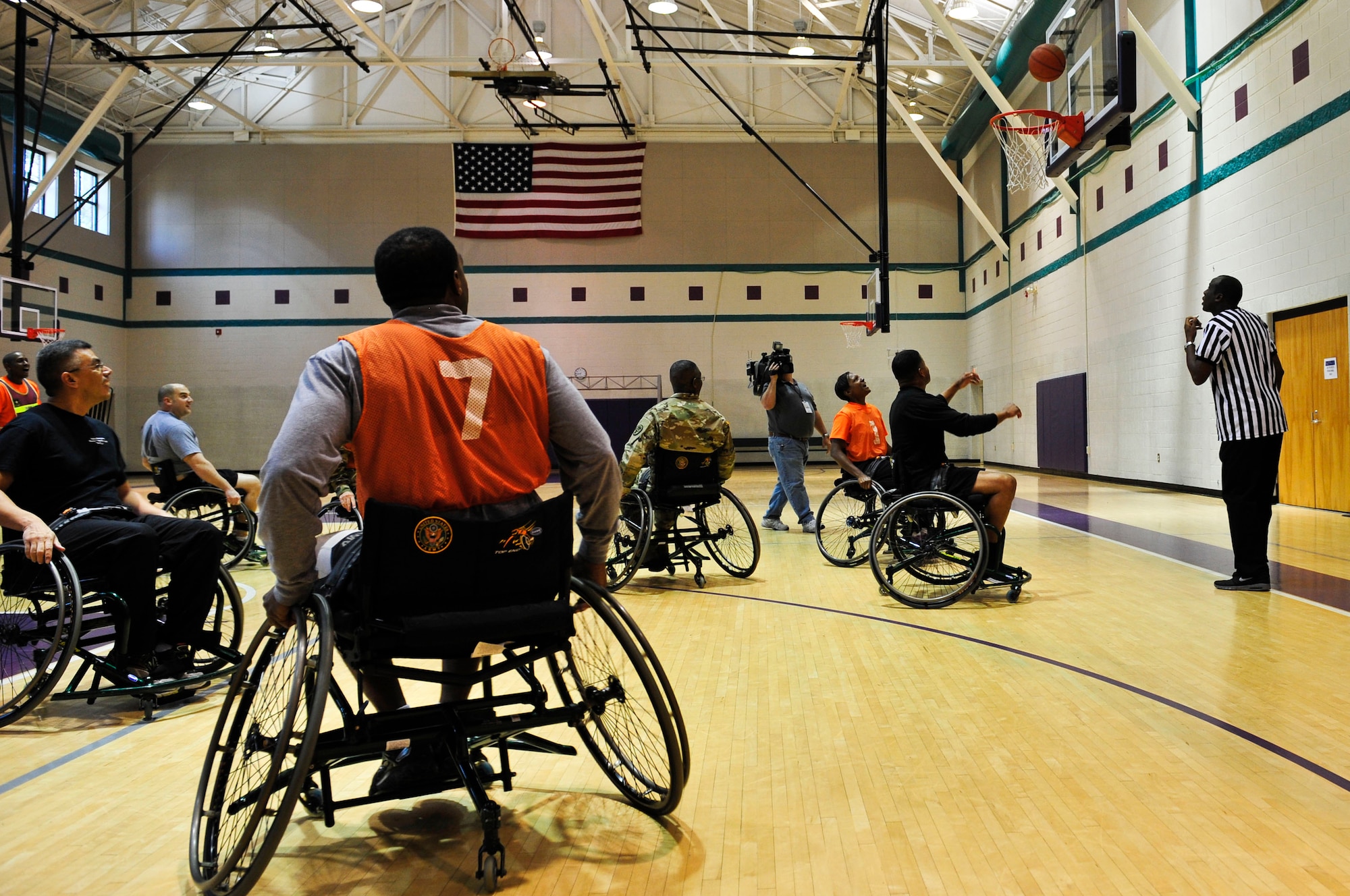 Members assigned to the Alpha Company Warrior Transition Unit participate in a wheelchair basketball game at McClellan Fitness Center during a WTU sports day at Fort Eustis, Va., Nov. 13, 2015. The sports day was a part of “Showing Your Strength through Reconditioning Week,” which Soldiers learned how to play sports despite their injuries. (U.S. Air Force photo by Senior Airman Breonna Veal)