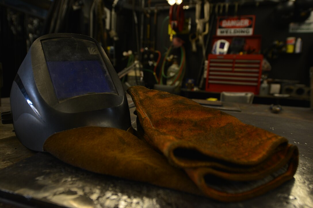 The Maritime and Intermodal Training school instructors require students and teachers have protective gear while at the welding shop at Fort Eustis, Va., Oct. 23, 2015. During the welding process, a face mask, coveralls and gloves must be worn to prevent injury during every class. (U.S. Air Force photo by Staff Sgt. Natasha Stannard)