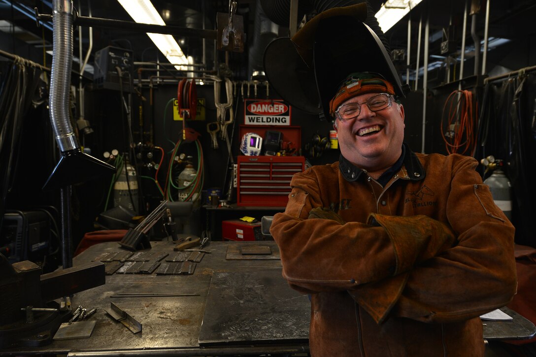 Jerome Weigel, the instructor of the Maritime and Intermodal Training school welding shop, poses for a photo at Fort Eustis, Va., Oct. 23, 2015. Weigel has instructed various types of welding techniques ranging from fixing large and small parts of vehicles and vessels for 15 years at Fort Eustis. (U.S. Air Force photo by Staff Sgt. Natasha Stannard)