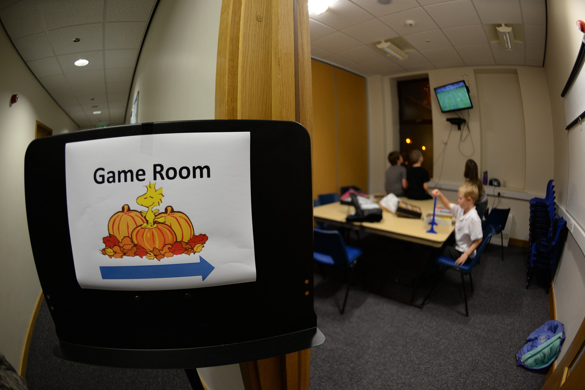 Children play in a game room during a Hearts Apart event for families of deployed Airmen Nov. 17, 2015, at the base chapel on RAF Mildenhall, England. The 100th Air Refueling Wing Staff Agencies and the 100th Comptroller Squadron provided a Thanksgiving meal, games and activities to help bring Team Mildenhall families closer together. (U.S. Air Force photo by Staff Sgt. Micaiah Anthony/Released)