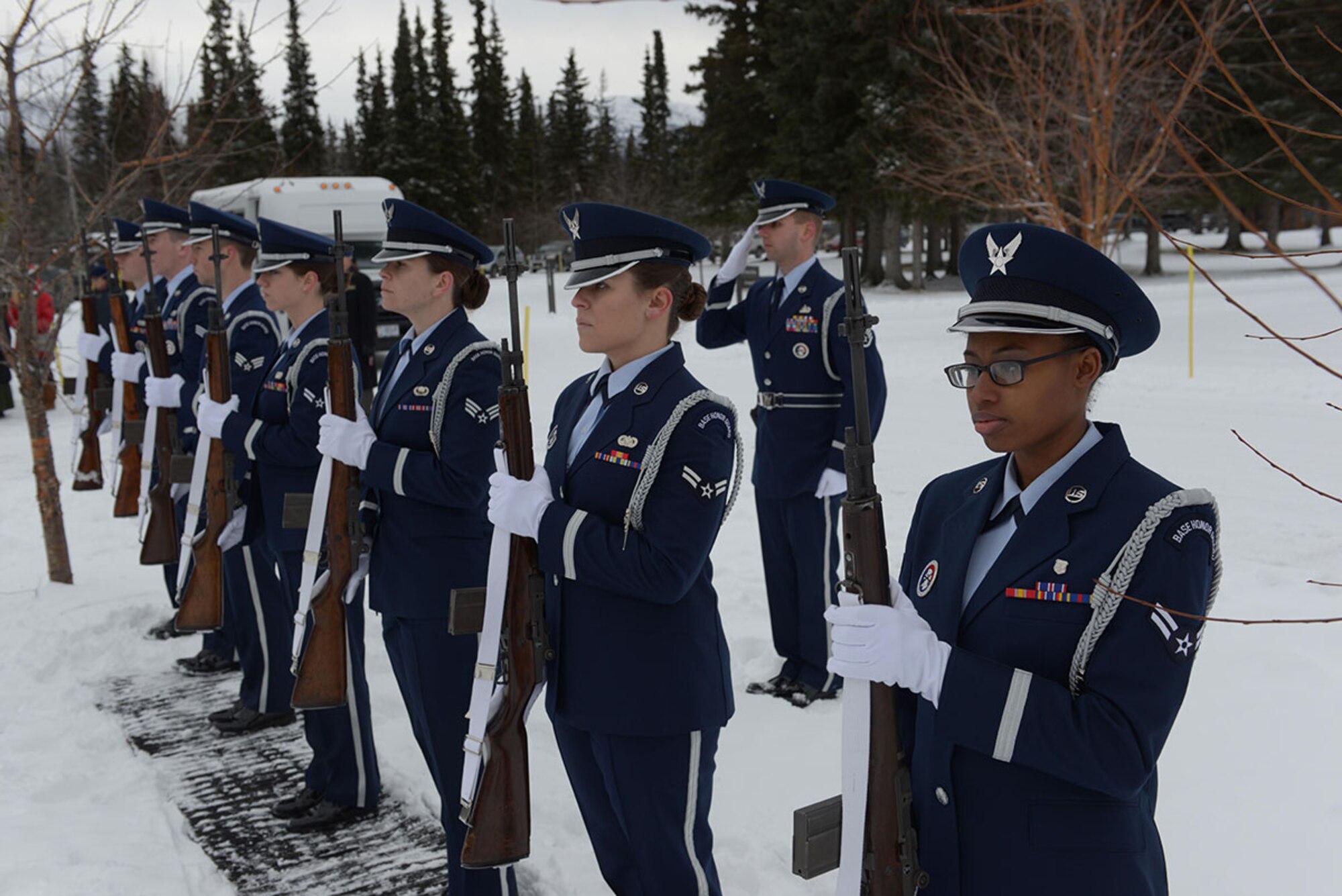 The Joint Base Elmendorf-Richardson Honor Guard, presents arms during the Royal Canadian Armed Forces Remembrance Day Cermeony at Fort Richardson National Cemetery on JBER, Nov. 11. Hundreds of veterans and their families attended the ceremonies, which included music, speeches and wreath layings. (U.S. Air Force photo/Staff Sgt. William Banton)