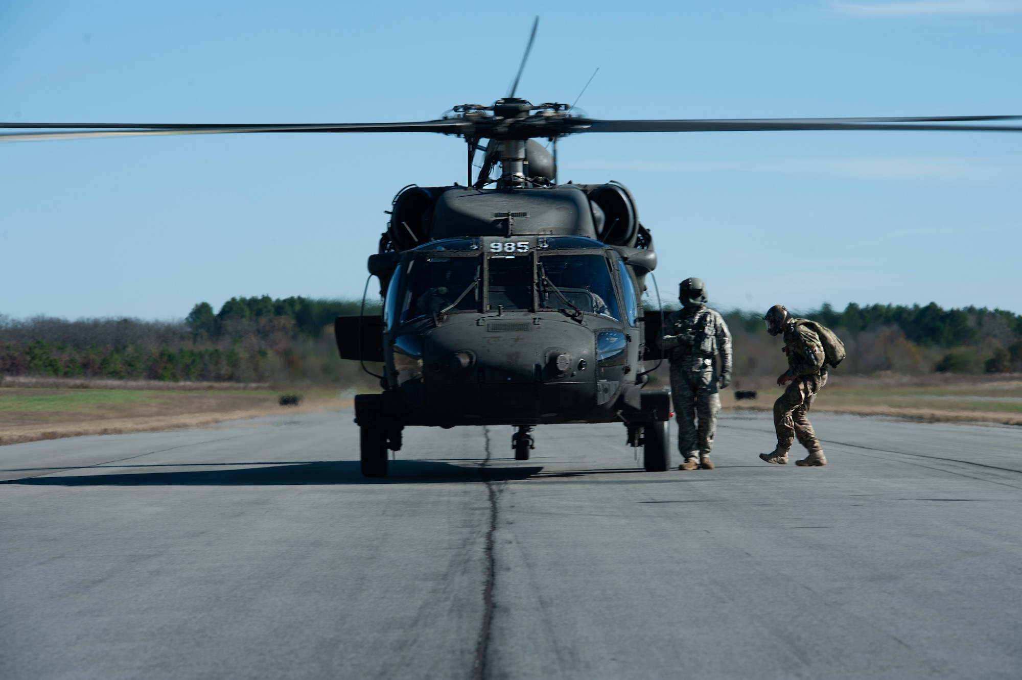 U.S. Air Force Tech. Sgt. Jason Martinez, Air Mobility Command Headquarters survival, evasion, resistance and escape operations command manager boards a UH-60 Blackhawk Nov. 12, 2015, at Camp Robinson, Ark. Martinez and other SERE specialists performed military free-fall jumps from 12,000 feet above ground level as part of MFF training. (U.S. Air Force photo by Airman 1st Class Mercedes Muro) 