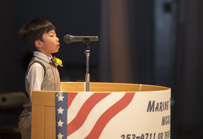 A Japanese contestant delivers his speech in English at the 54th Annual Japanese and American Speech Contest at the Sinfonia  Iwakuni in Iwakuni, Japan, Nov. 8, 2015. Each contestant wrote their own masterpiece that judges critiqued for voice control, fluency and hand movements.
