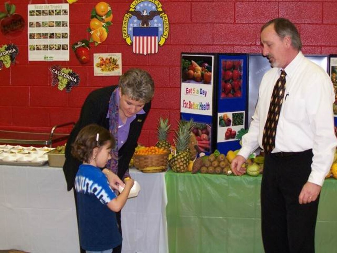 Ken Wilmoth, Subsistence customer relations supervisor, talks about fresh fruit and vegetables with school children during a presentation. Wilmoth's team works with customers at military bases and schools in the Southeast to ensure they receive quality produce. 