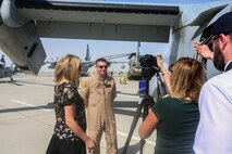Capt. John Campbell, a pilot and a weapons and tactics instructor with the Red Dragons of Marine Medium Tiltrotor Squadron 268, Aviation Combat Element of Special Purpose Marine Air-Ground Task Force Crisis Response Central Command 16.1., conducts a media interview during 2015 Dubai Air Show, Dubai World Central, United Arab Emirates from November 8 - 12.