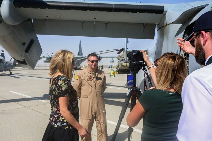 Capt. John Campbell, a pilot and a weapons and tactics instructor with the Red Dragons of Marine Medium Tiltrotor Squadron 268, Aviation Combat Element of Special Purpose Marine Air-Ground Task Force Crisis Response Central Command 16.1., conducts a media interview during 2015 Dubai Air Show, Dubai World Central, United Arab Emirates from November 8 - 12.