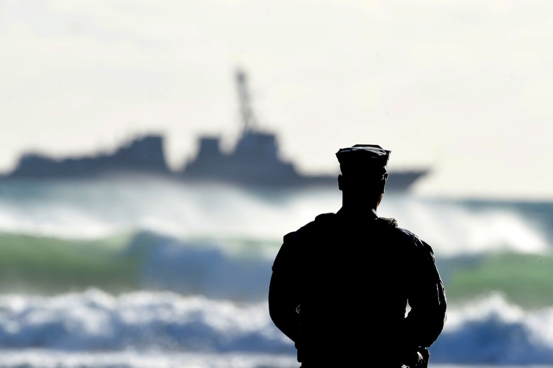 Navy Petty Officer 3rd Class Anthony Dodson stands watch as the guided-missile destroyer USS Stockdale sits anchored off the southern coast of California in the Pacific Ocean, Nov. 16, 2015. Dodson is a master-at-arms. U.S. Navy photo by Petty Officer 2nd Class Timothy M. Black