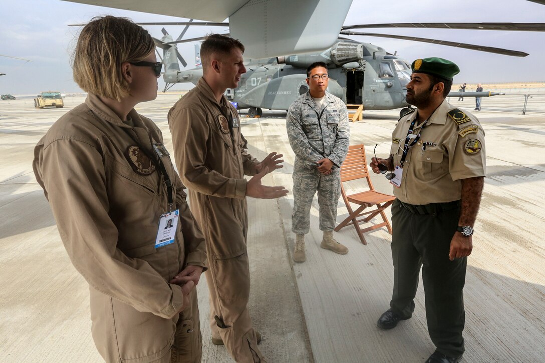 From left to right: Staff Sgt. Kristie Ness, a crew chief  and Sgt. Dan Leneghan, a maintenance controller, with the Red Dragons of Marine Medium Tiltrotor Squadron 268, Aviation Combat Element, Special Purpose Marine Air-Ground Task Force Crisis Response Central Command 16.1 showcased some of the unit's aviation capabilities to thousands of foreign military personnel and distinguished visitors at the 2015 Dubai Air Show, Dubai World Central, United Arab Emirates from November 8 - 12.